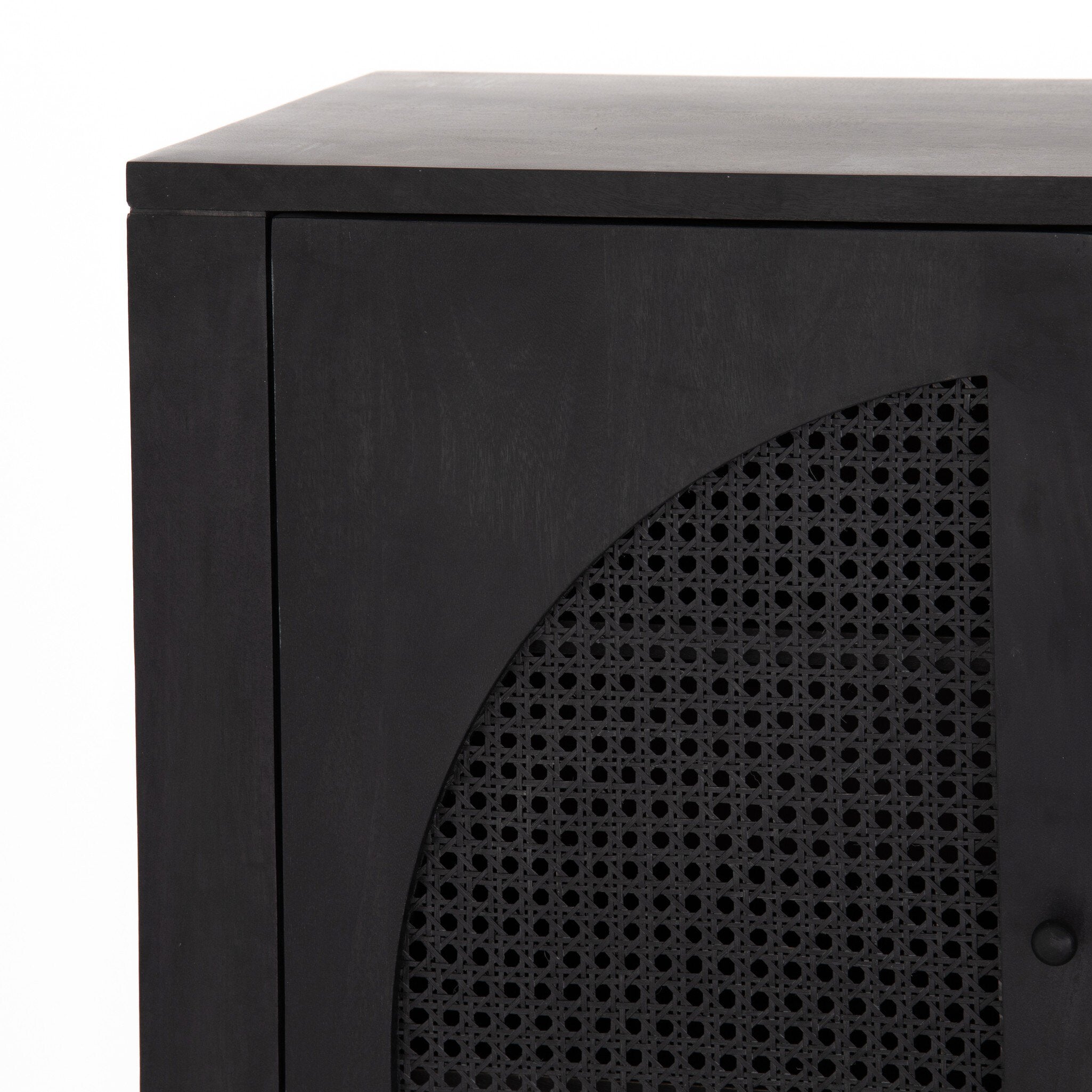 Closeup of the black tilde sideboard with arched cane door panels.