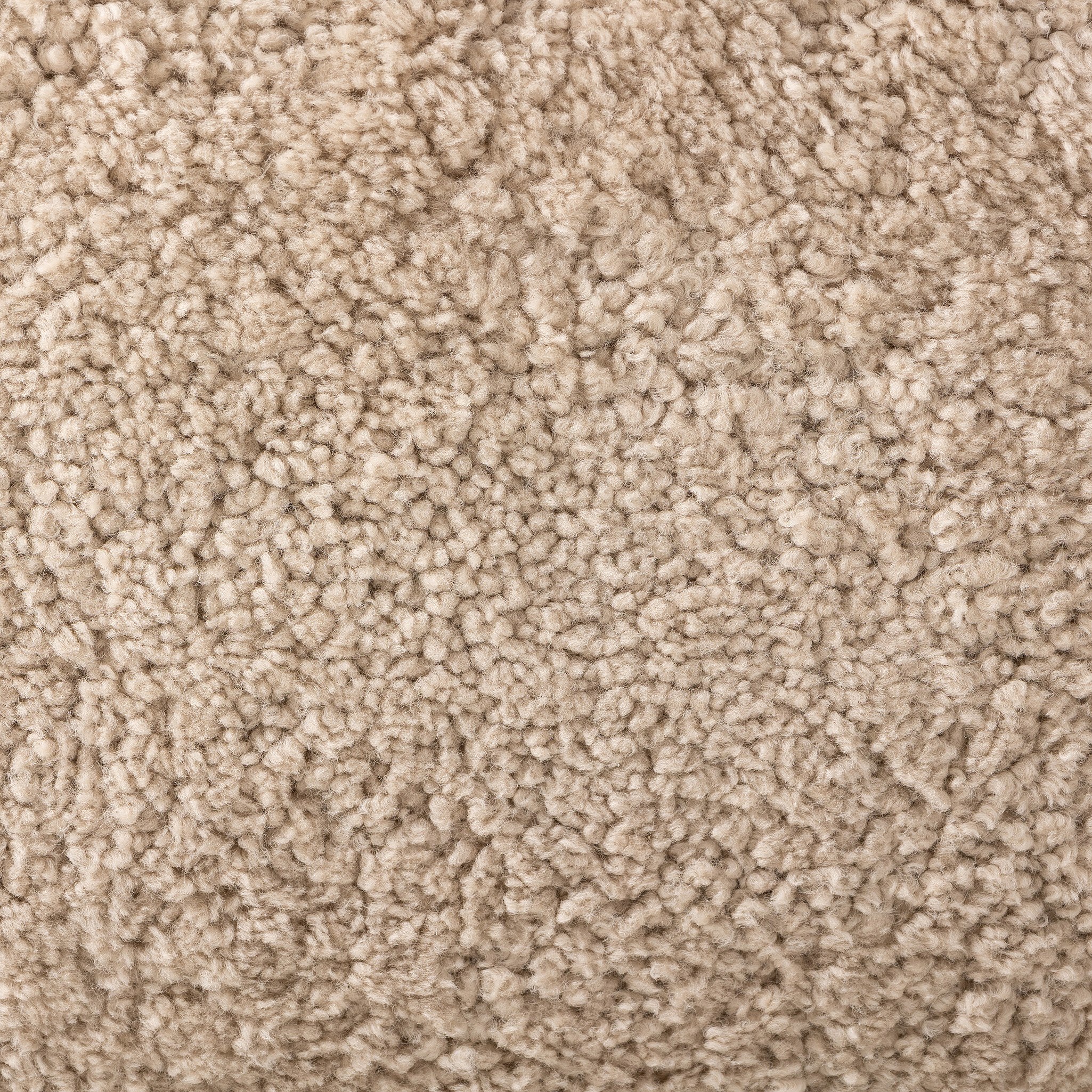 Close up of a natural beige shearling armchair on a white background.