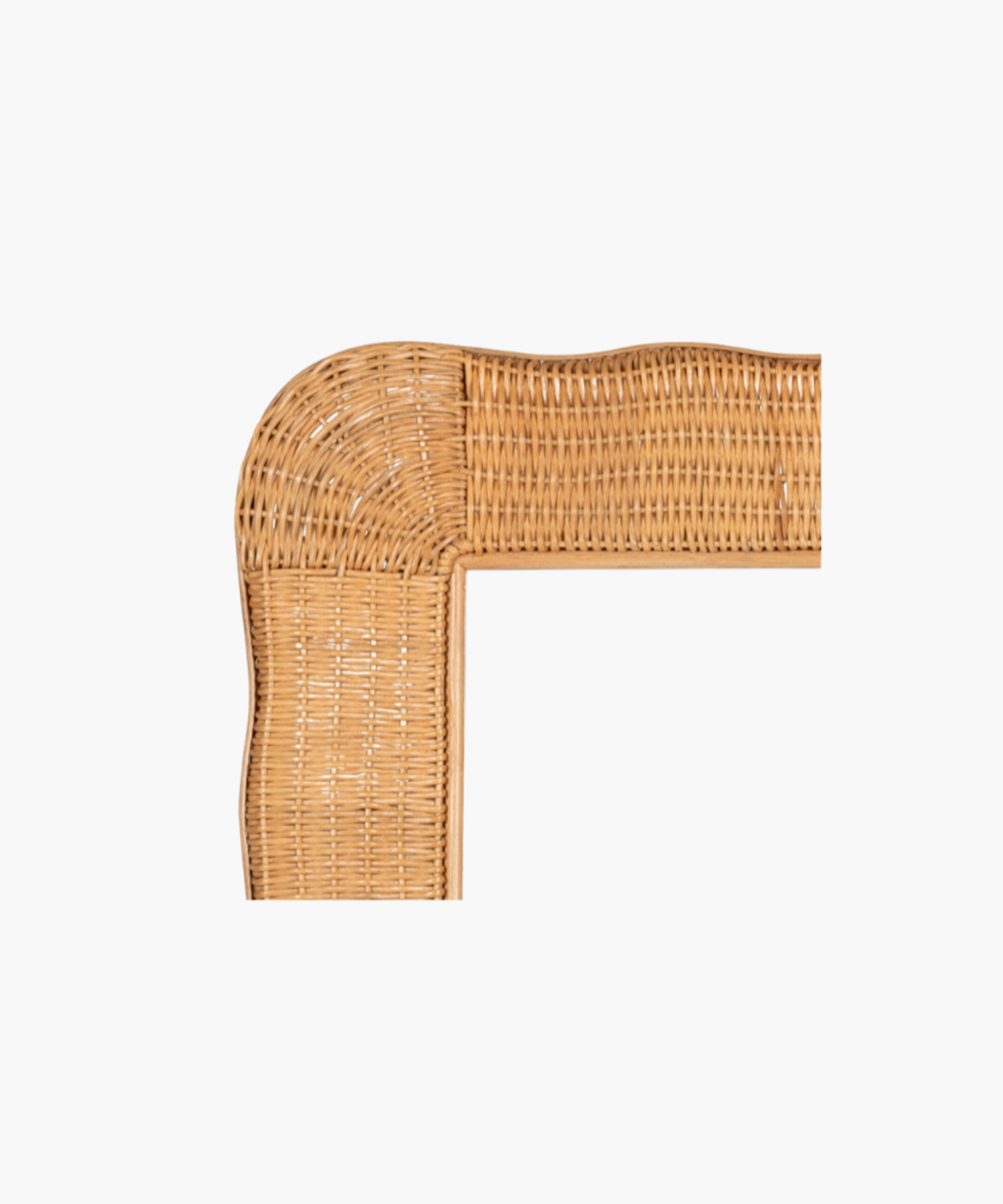 Close-up of a rattan frame in a natural finish.