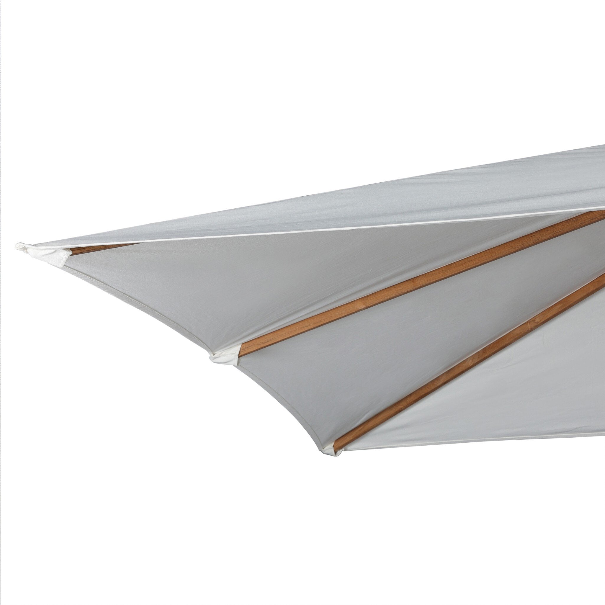 Close up of a white patio umbrella with wooden frame and black base on a white background.