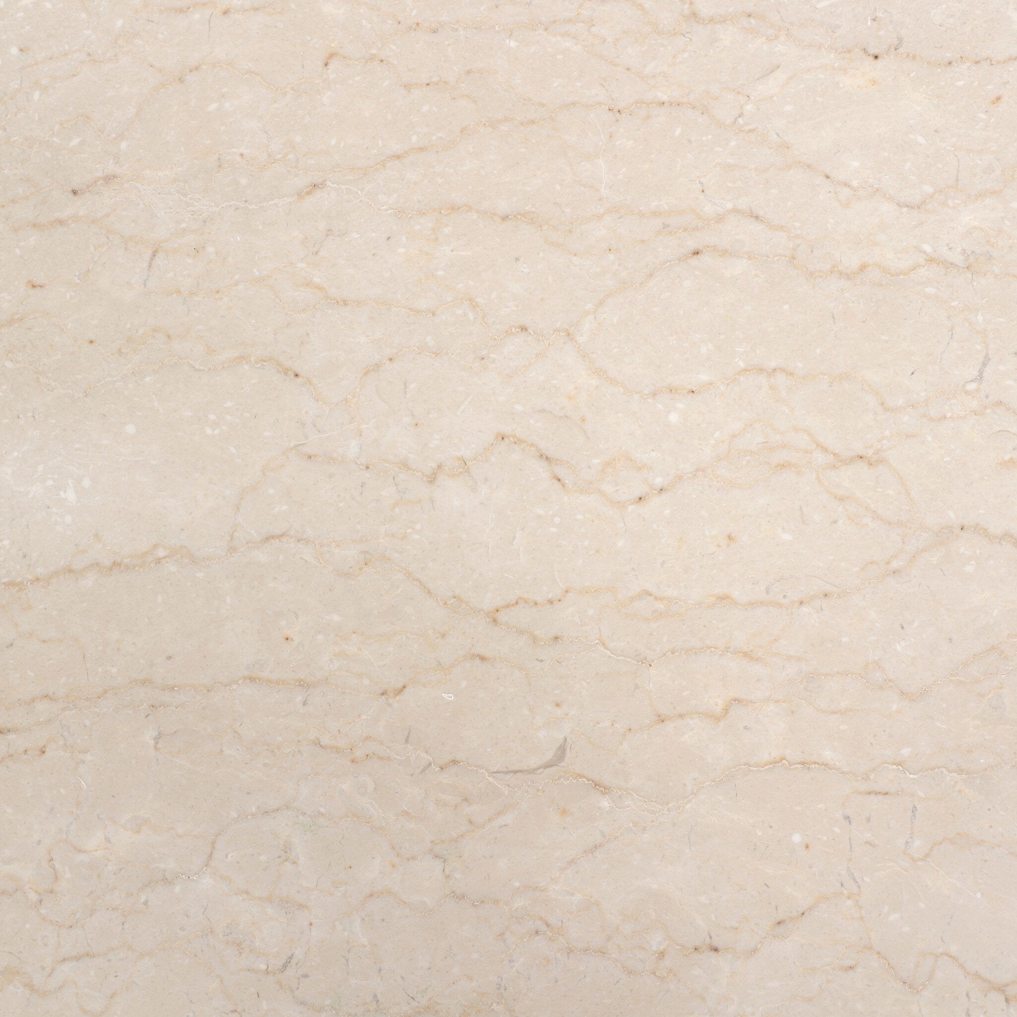 Close up the marble top from the nightstand showing its color and veining.