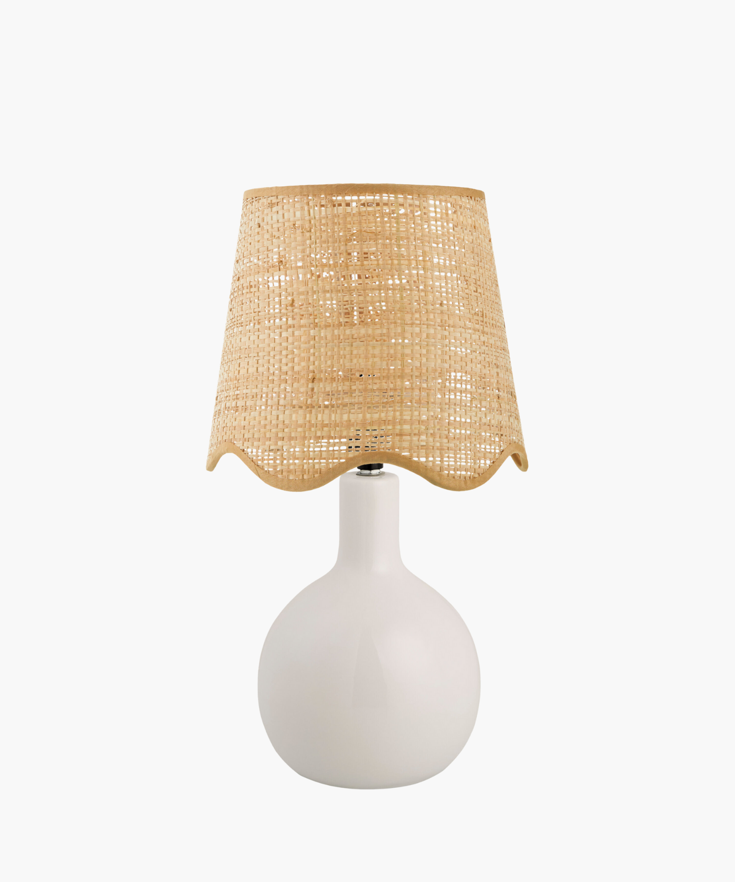 A modern table lamp with a sleek white ceramic base and a woven beige rattan shade. The design is minimalist, giving a cozy, natural feel. | S.W. Home