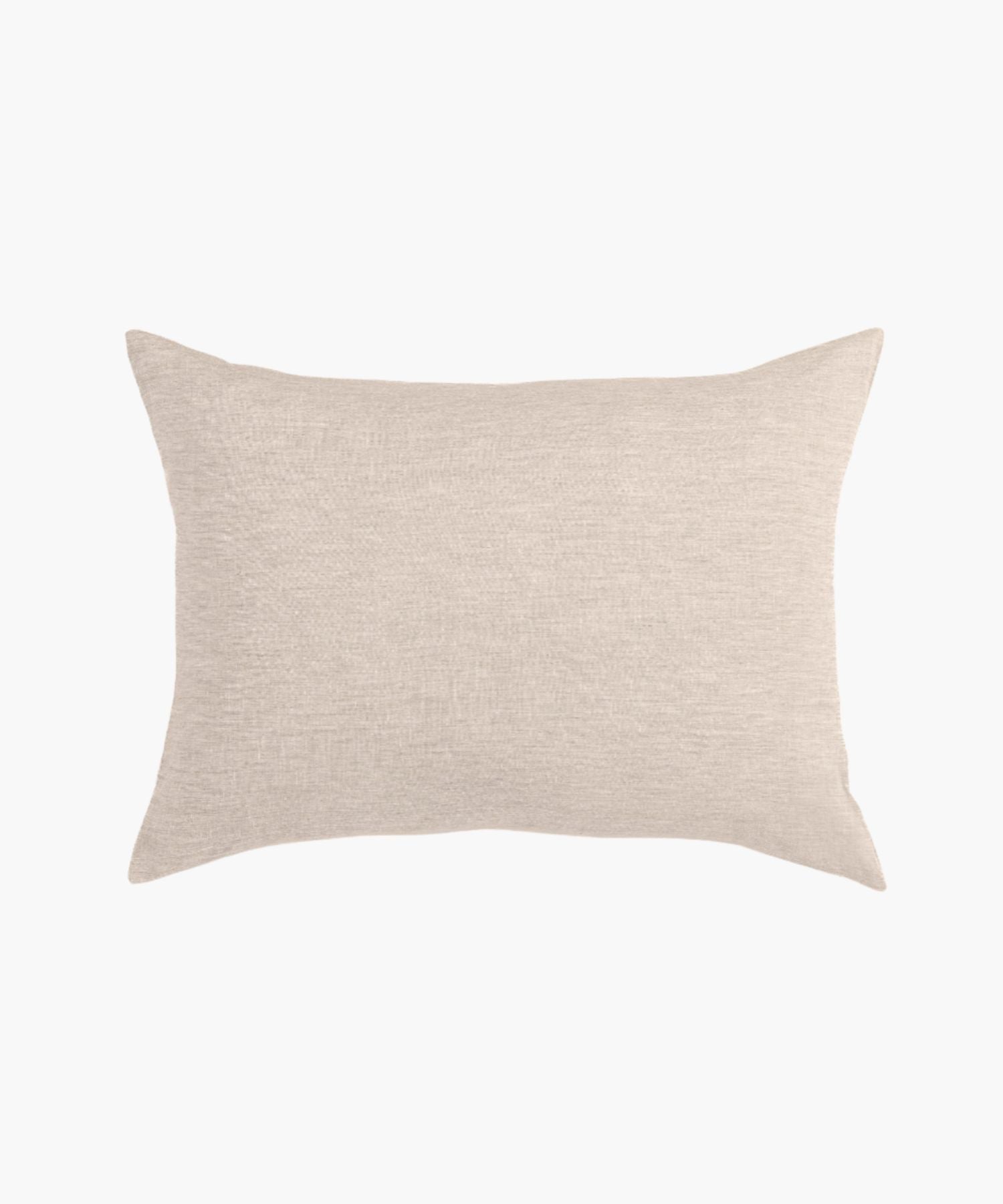 Pillow cover styled on a white background, showing knife edge or flange detailing, fabric texture, and muted palette. | Wildwood Home Co.