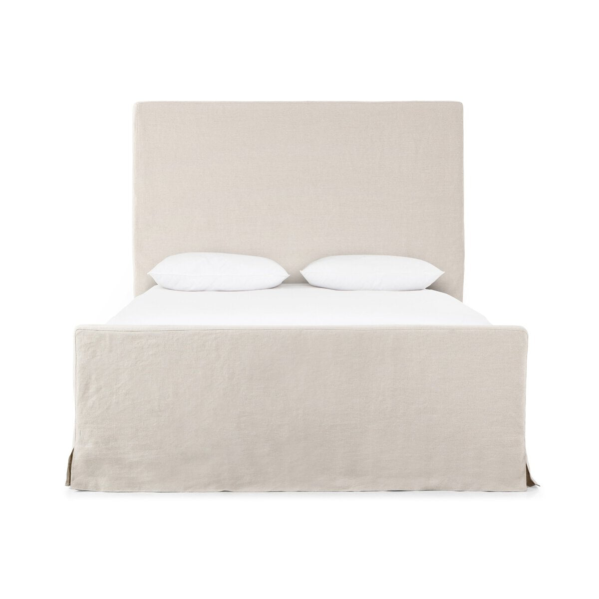 Beige slipcover bed with white bedding on a white background. | SW Home