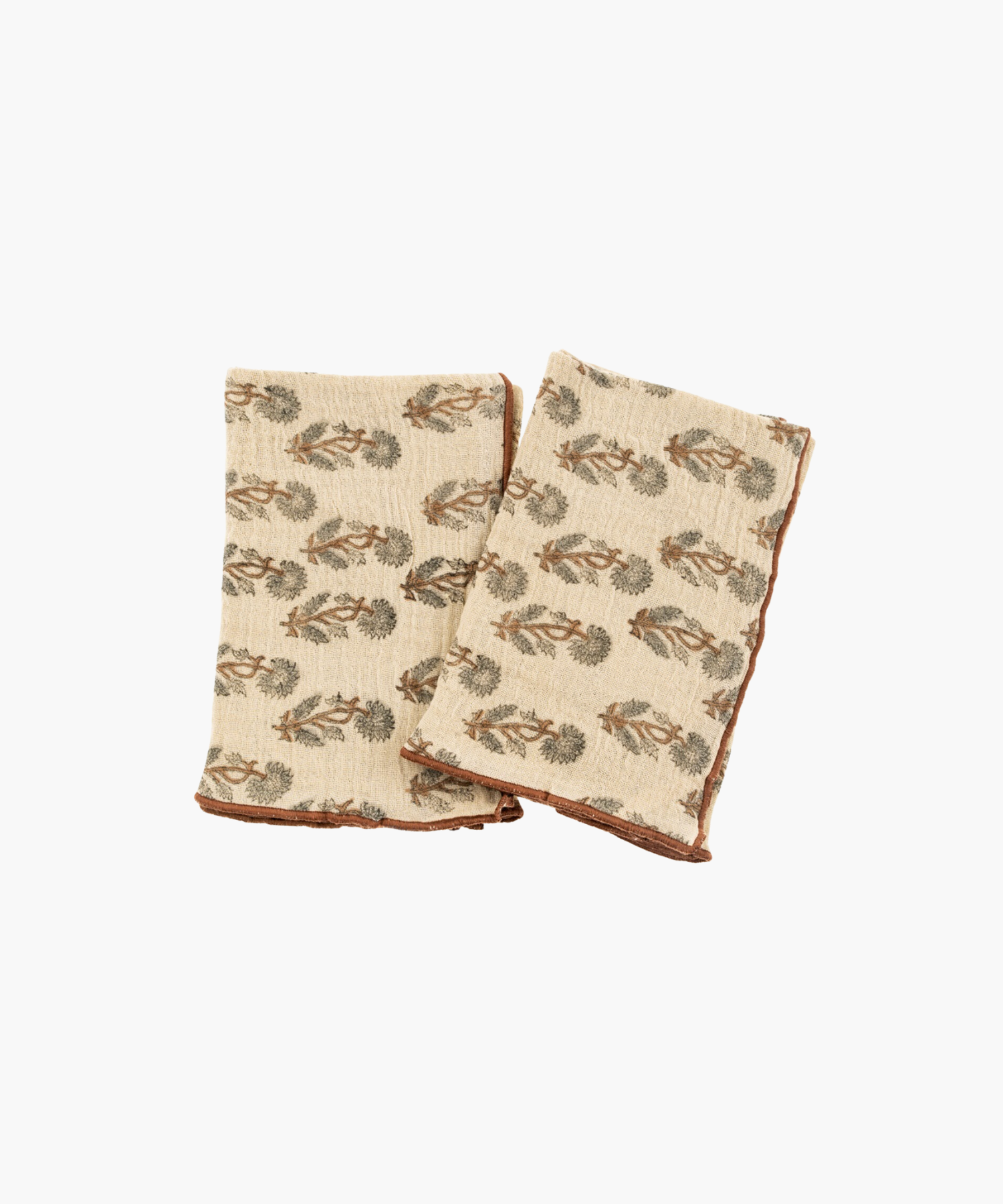 Two beige kitchen towels with brown borders, decorated with a green and brown tree pattern. The fabric appears soft and cozy, evoking a rustic charm. | S.W. Home