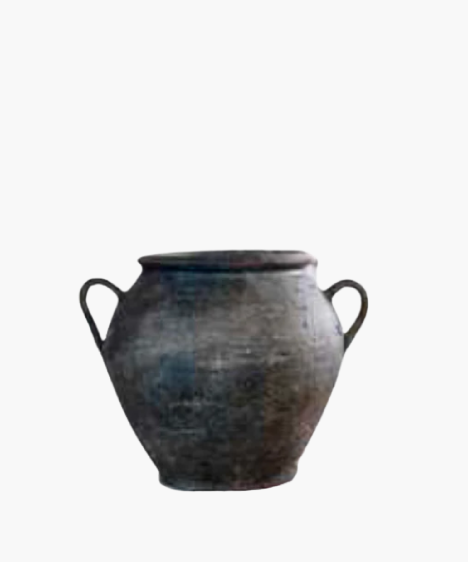 Aged, dark clay pot with two curved handles on each side. The surface is textured, showing signs of wear, conveying a sense of history and rustic charm. | S.W. Home
