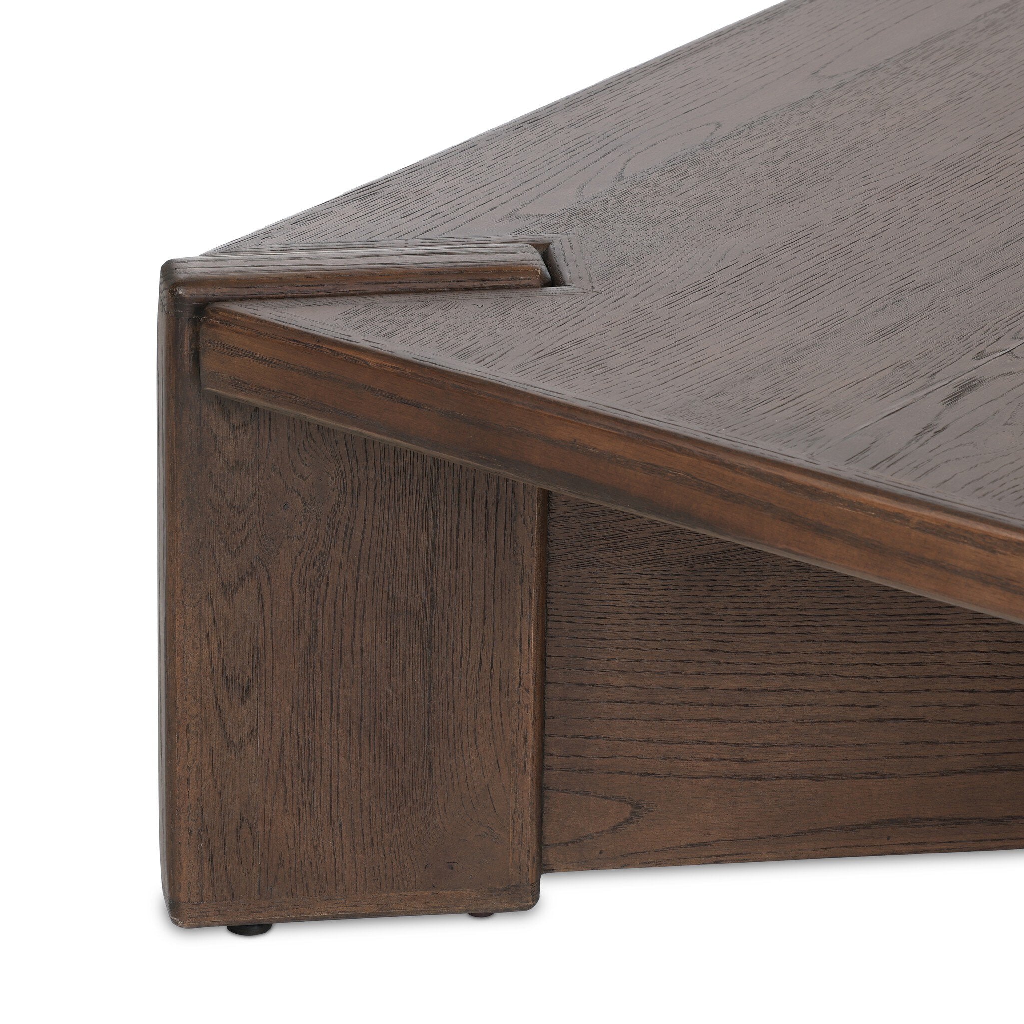 Close up of a wooden coffee table with a textured surface on a white background.