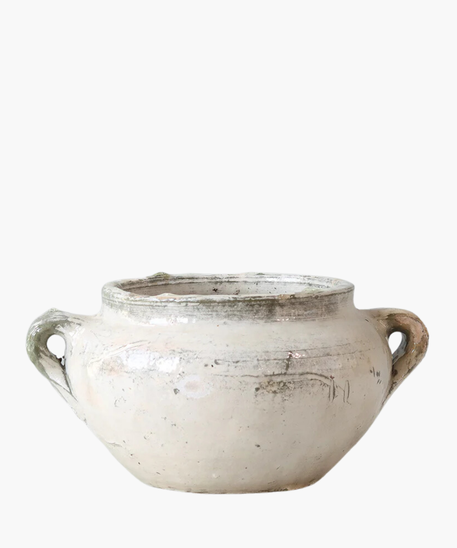 A rustic, cream-colored ceramic pot with two handles on each side. The surface is worn and mildly textured, conveying an antique feel. | S.W. Home