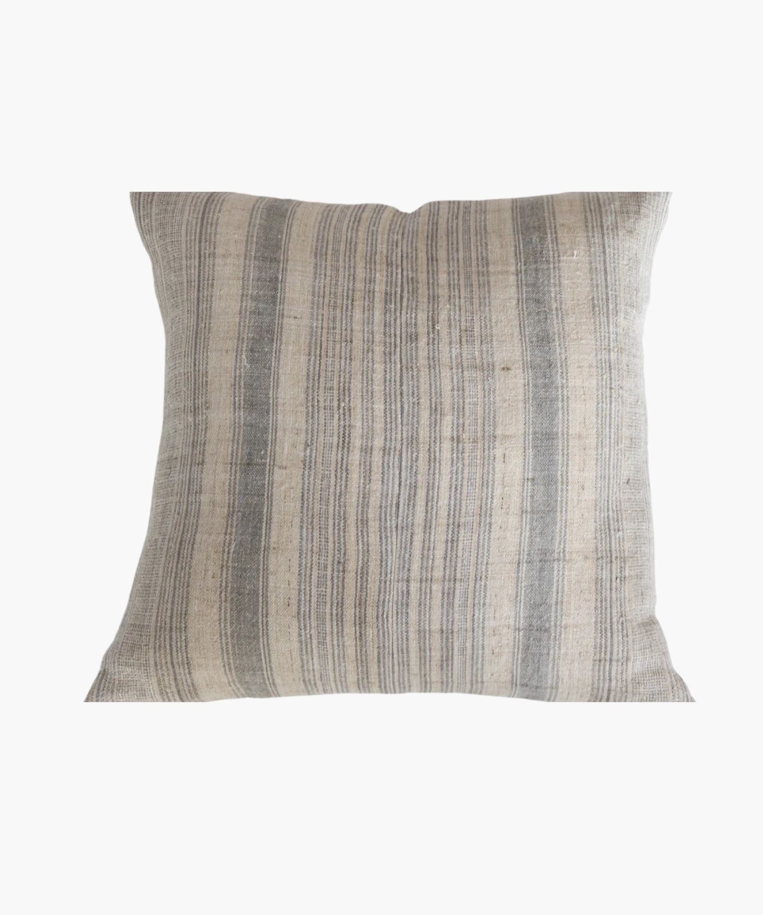 A square pillow cover with a neutral hemp background features vertical grey and blue stripes. The texture appears soft and slightly textured, conveying a cozy and rustic feel. | SW Home