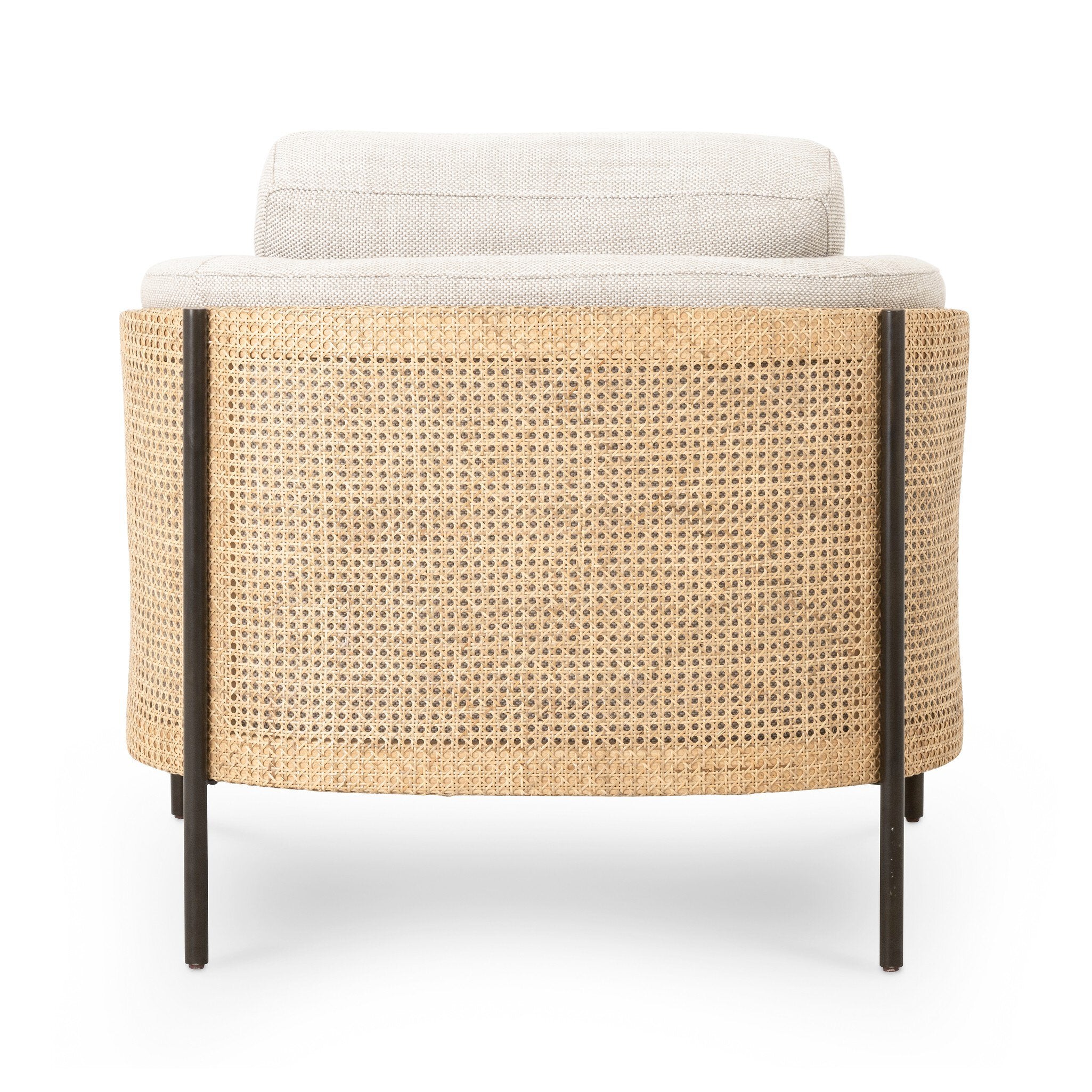 The back of a beige armchair with dark metal legs on a white background.