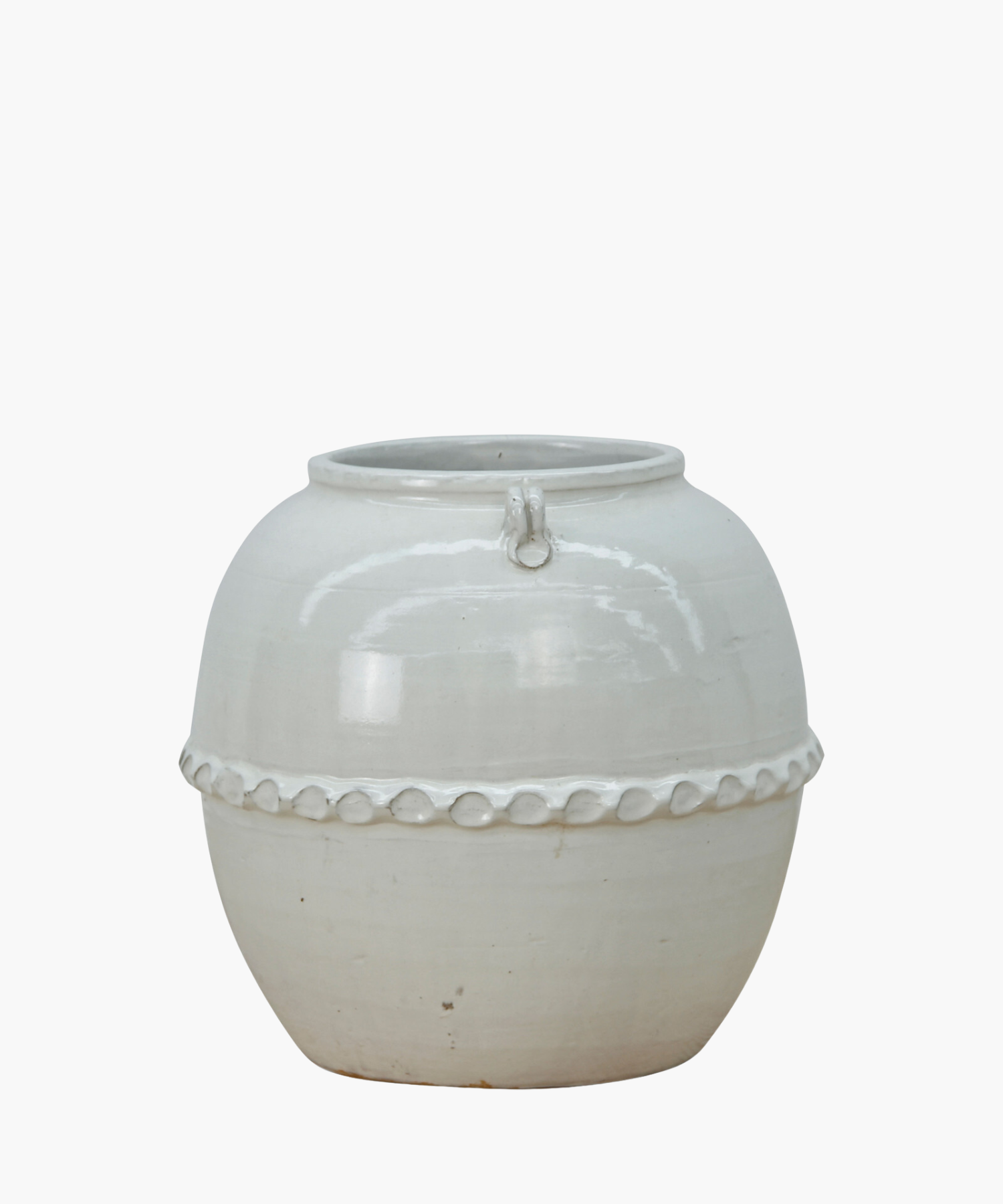 A white ceramic pot with a glossy surface and rounded shape. It features a decorative band with a loop design near the top, giving an elegant look.| S.W. Home