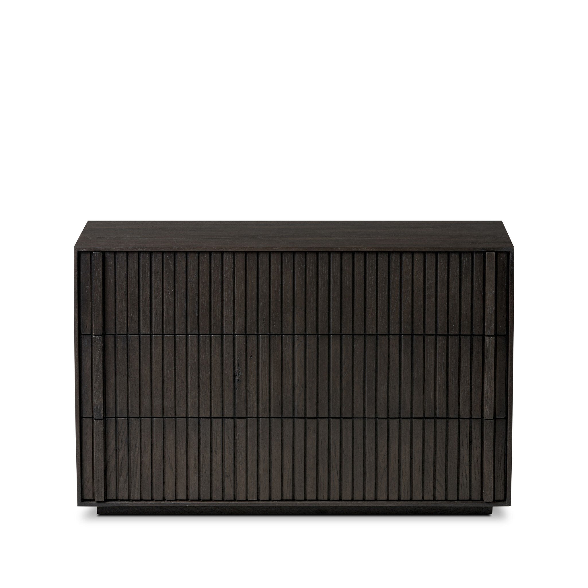 Dark wooden dresser with vertical reed detailing and three drawers on a white background. | S.W. Home