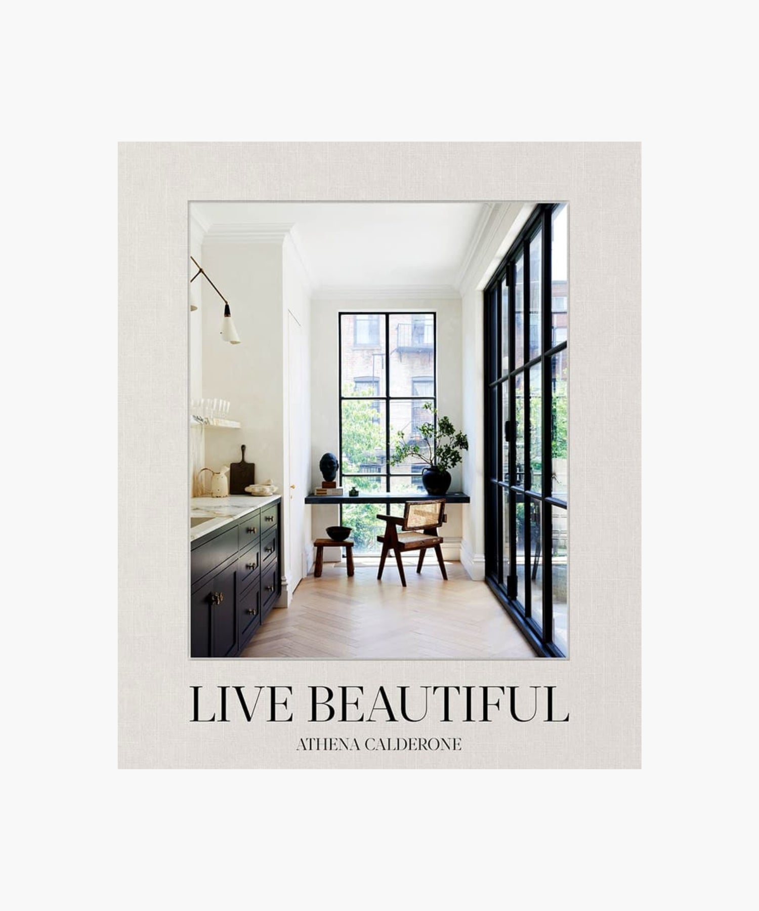 The cover of the book "Live Beautiful" by Athena Calderone features a stylish interior design with large windows, minimalistic furniture, and natural light. The tone is serene and elegant. | S.W. Home