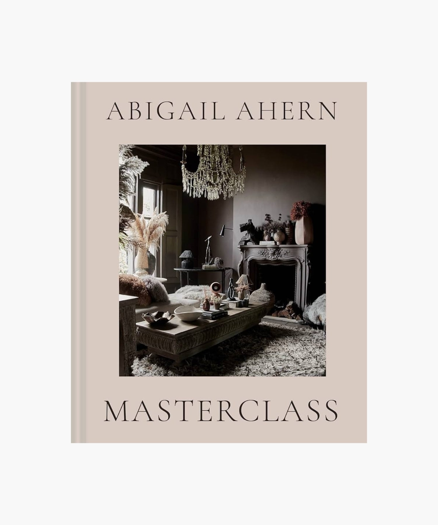 The cover of the book "Masterclass" by Abigail Ahern features an elegant room with moody decor, featuring a chandelier, ornate fireplace, and textured furnishings. | S.W. Home