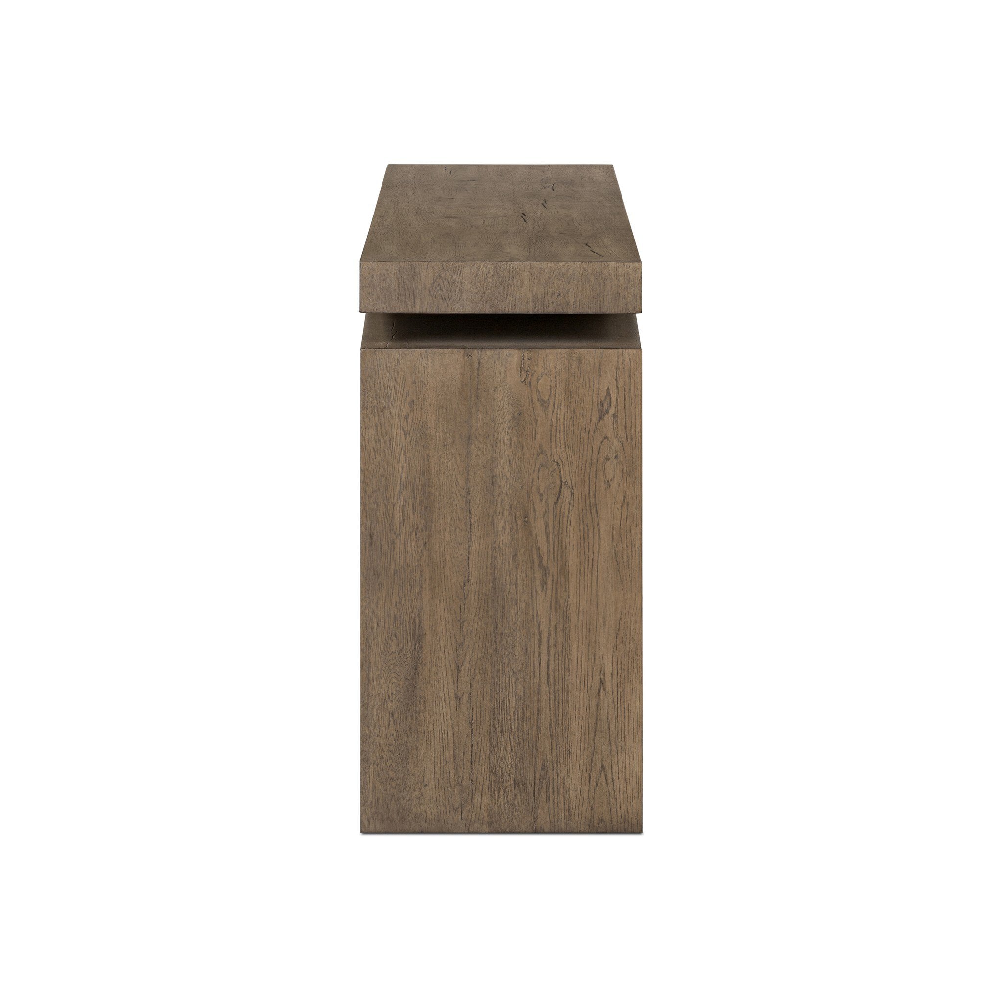 Side profile of a wooden console table with a curved design on a white background.