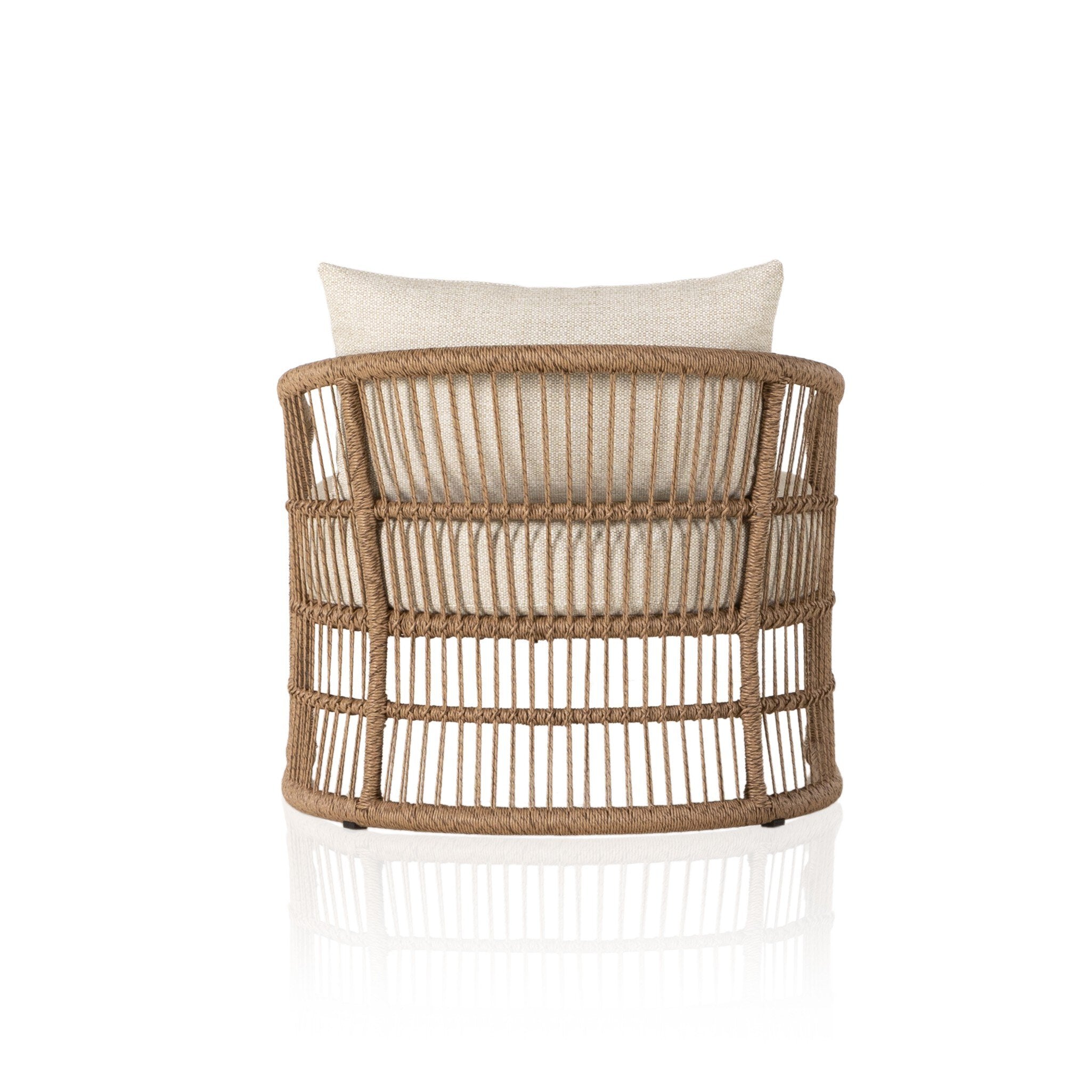 The back of a cottage inspired outdoor chair with wrapping and texture along with beige colored upholstered cushions on a white background.
