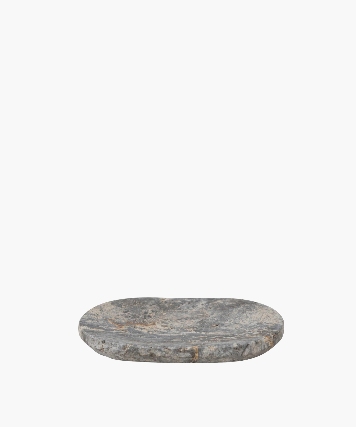 Oval shaped travertine soap dish with a rough, textured surface in shades of gray and hints of brown. It conveys a rustic, natural, and minimalist aesthetic. | S.W. Home