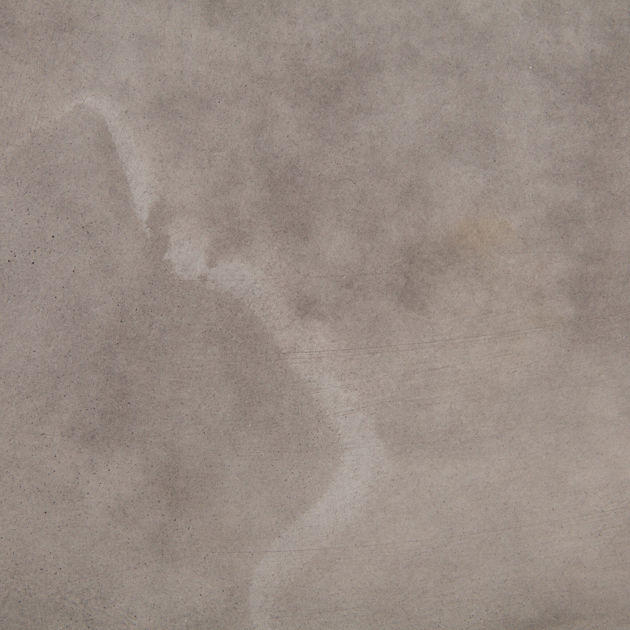 Close up of the dark grey concrete showing color and texture.