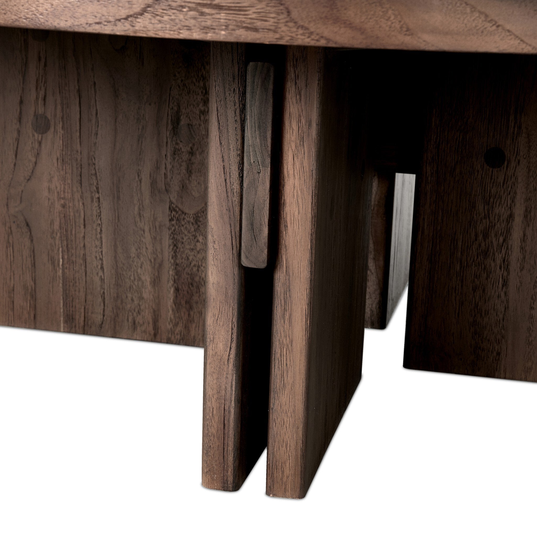 Close up of a solid teak coffee table showing its linear joints and connection details.