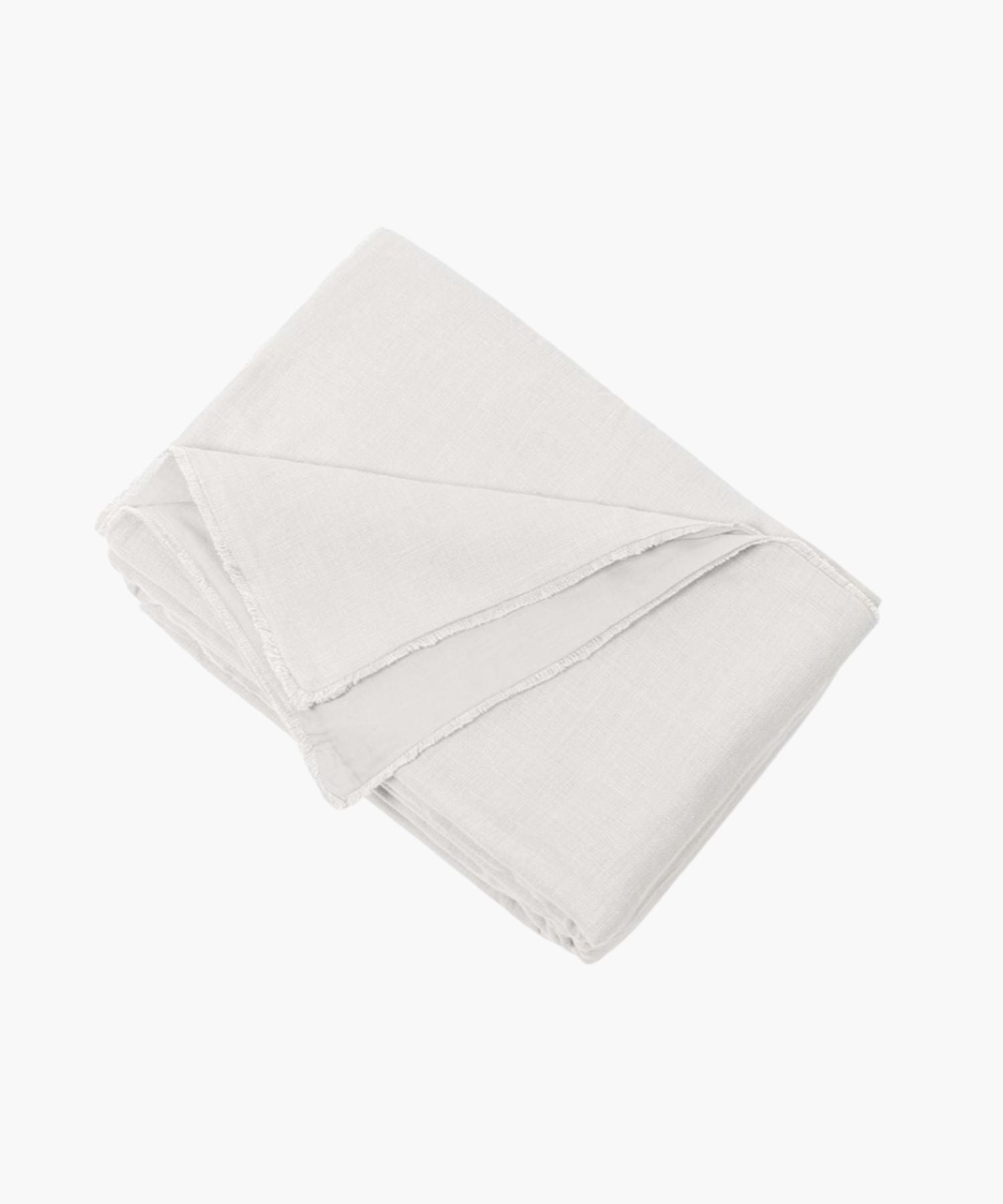 Neatly folded ivory linen duvet cover on a white background showing texture and soft tonal color. | Wildwood Home Co.