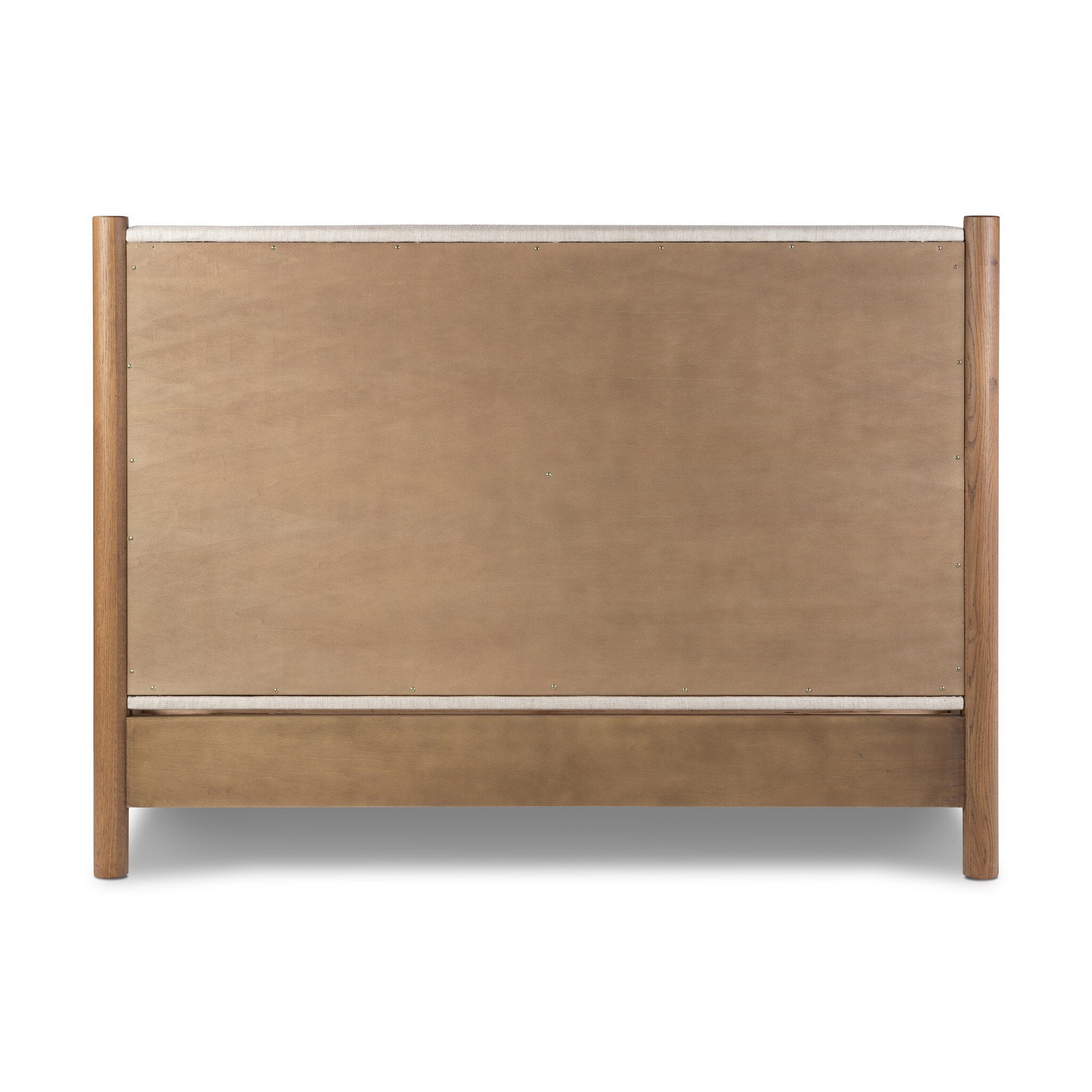 The back of a wooden bed with upholstered headboard and white bedding on a white background.