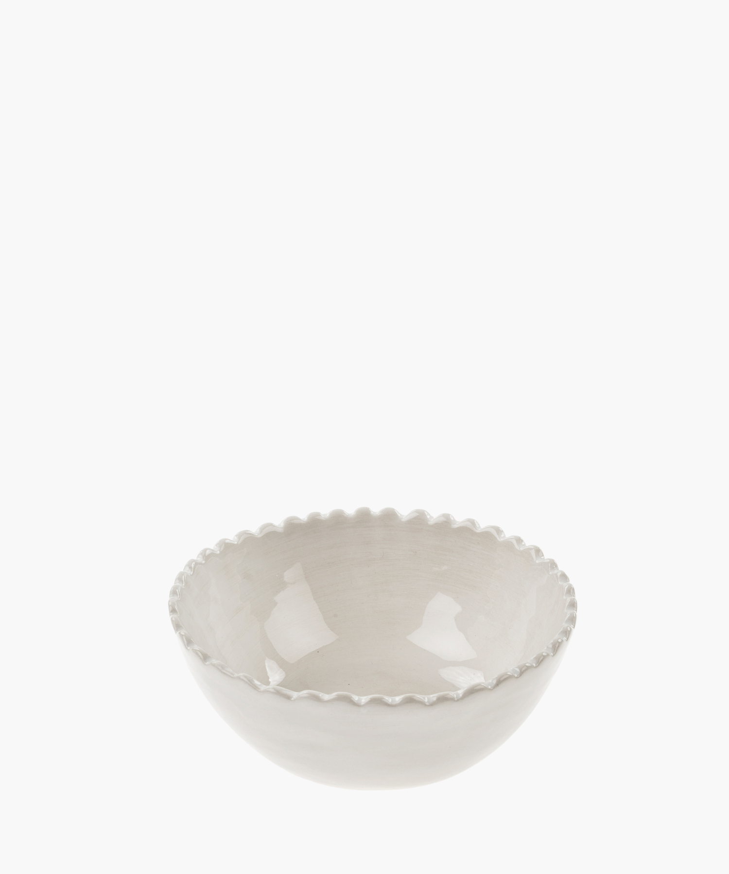 A white ceramic bowl with a glossy finish and a scalloped edge, set against a white background. The simple design conveys elegance and minimalism. | S.W. Home