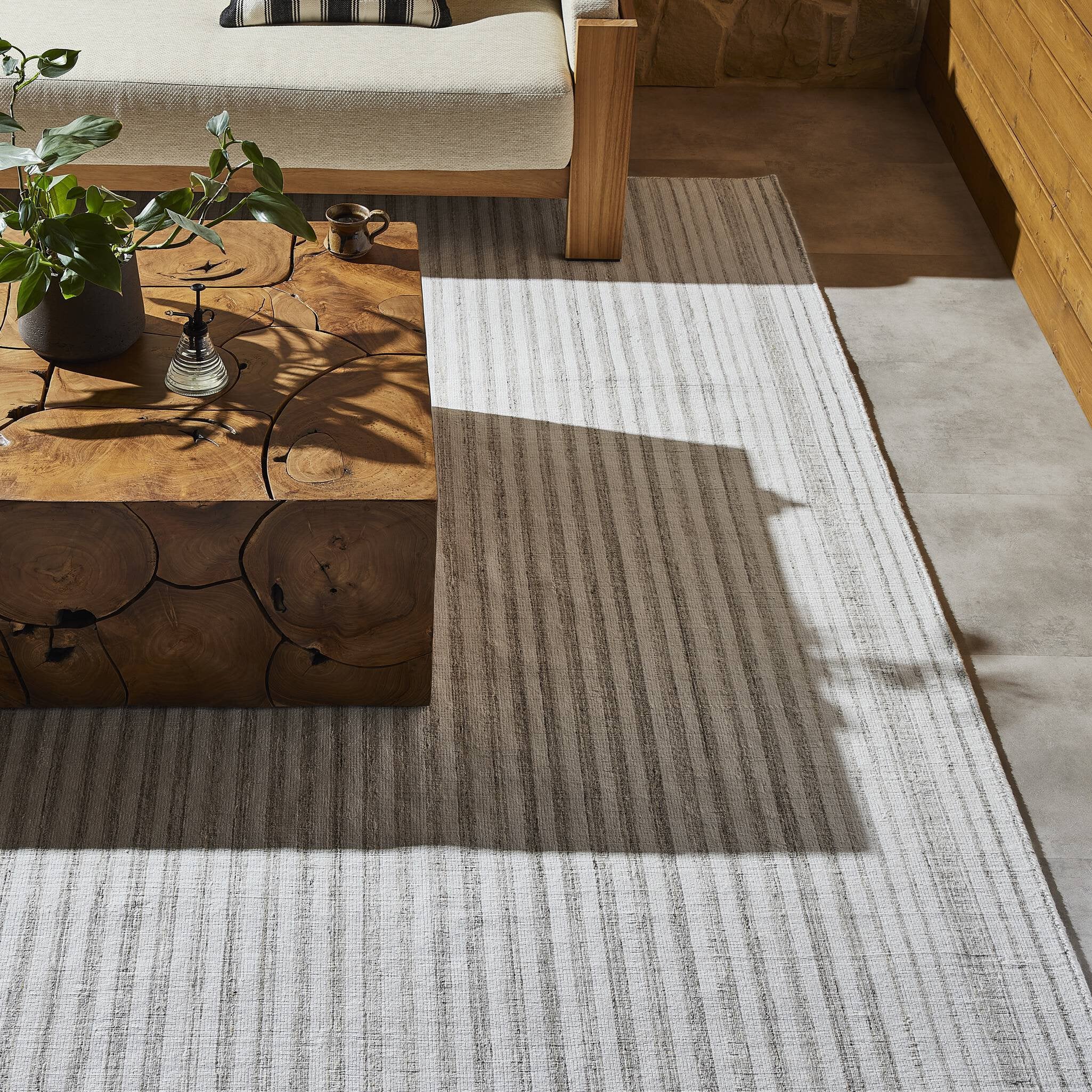 Rectangular outdoor rug with a striped pattern on a white background. | SW Home