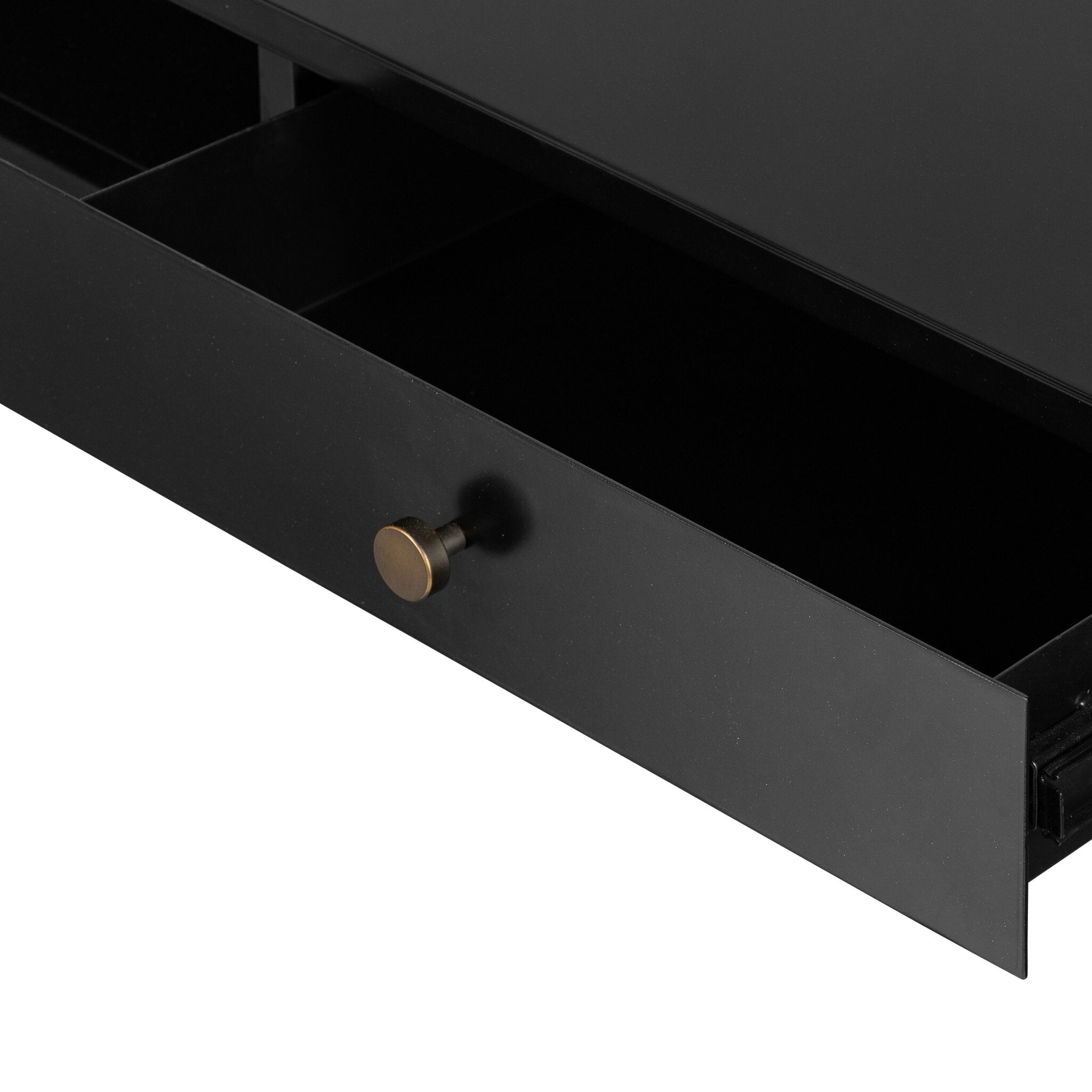 Close up of a black drawer with a gold handle on a white background.