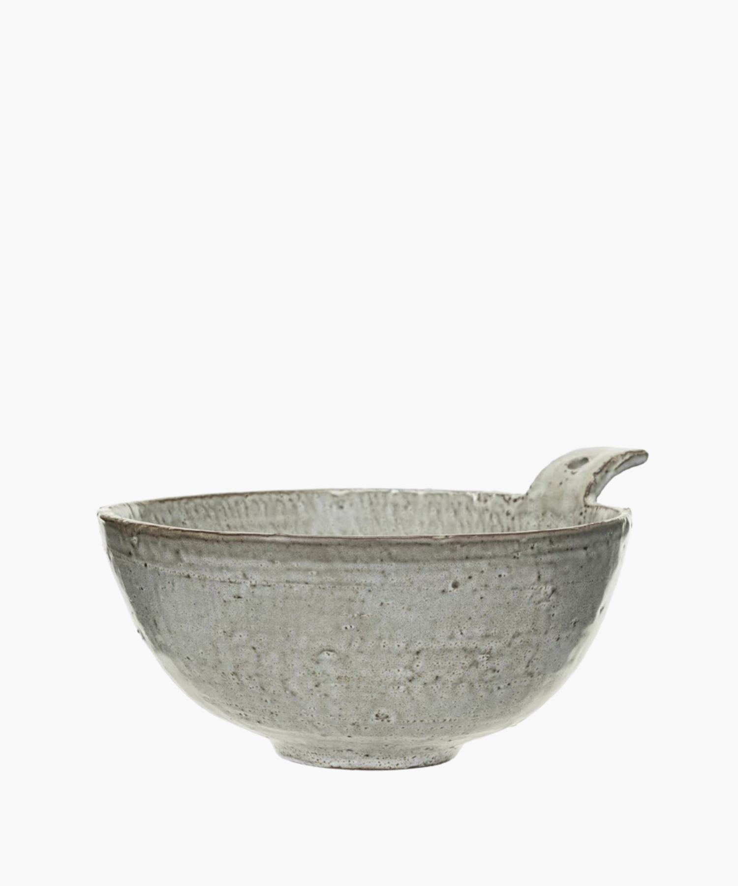 Rustic gray ceramic bowl with a textured surface and a unique spout handle. The design is minimalist, conveying a sense of simplicity and elegance. | S.W. Home