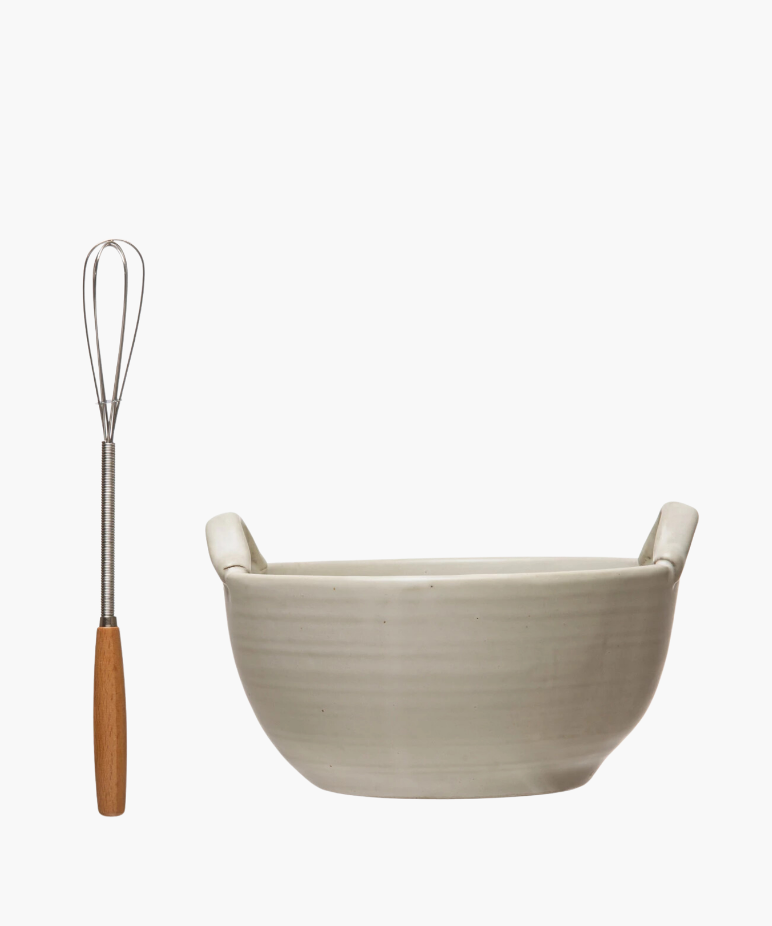 A cream colored stoneware ceramic mixing bowl with a metal whisk, evoking a clean, minimalist aesthetic. | S.W. Home