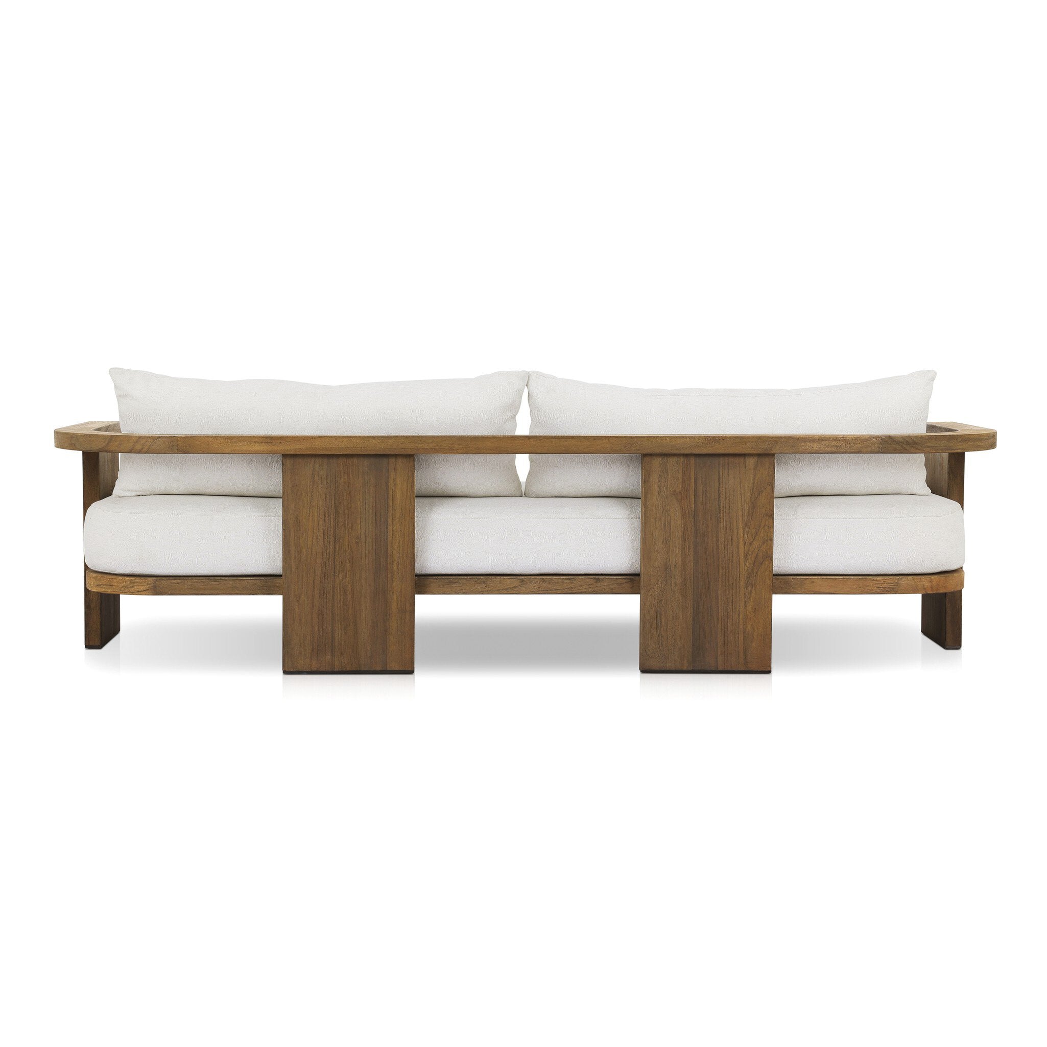 Outdoor sofa with curved wooden frame out of teak and white linen cushions from the back on a white background.
