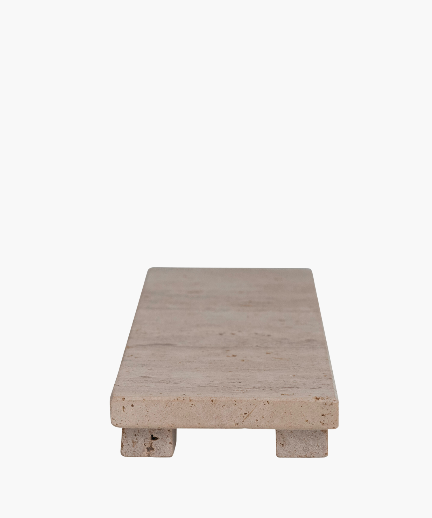 Rectangular travertine tray with a smooth, beige surface, elevated on two block legs. The minimalist design gives a clean, modern aesthetic. | SW Home