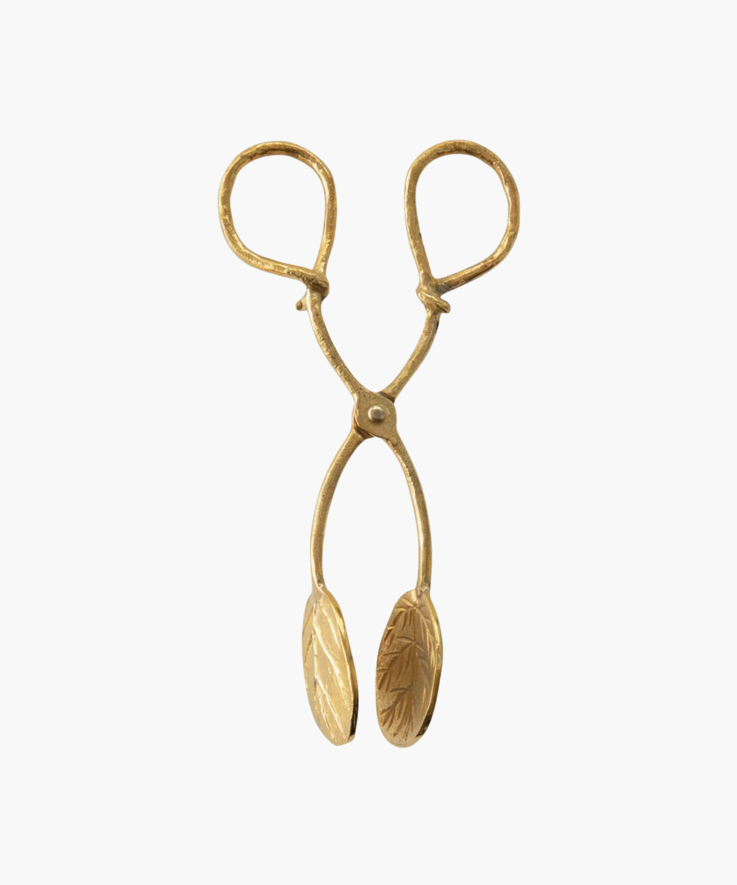 A pair of ornate, antique inspired gold tongs with detailed leaf engravings on the grips. The design conveys elegance and vintage charm. | S.W. Home