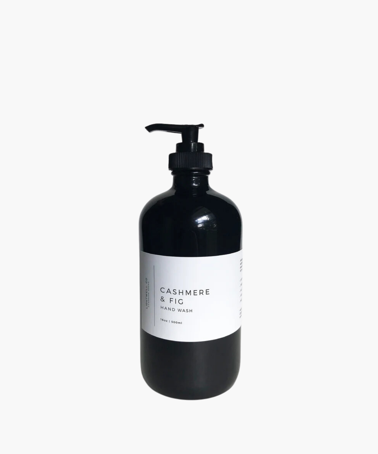 A sleek black bottle with a pump dispenser labeled "Cashmere & Fig Hand Wash." Minimalist design conveys elegance and a sense of luxury. | SW Home