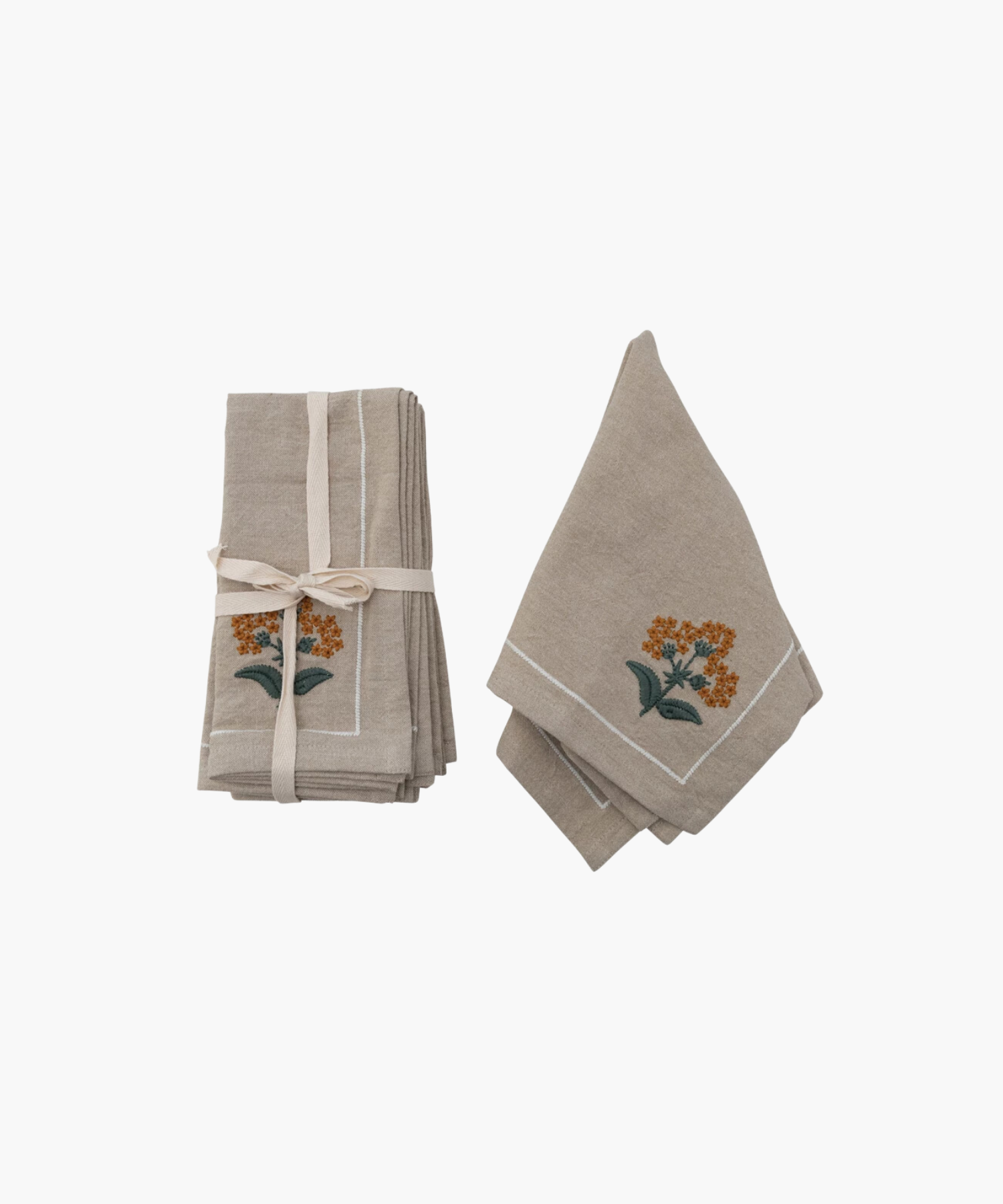 Two beige cloth napkins with orange floral embroidery. One stack is tied with a ribbon, the other folded open, suggesting elegance and simplicity. | S.W. Home