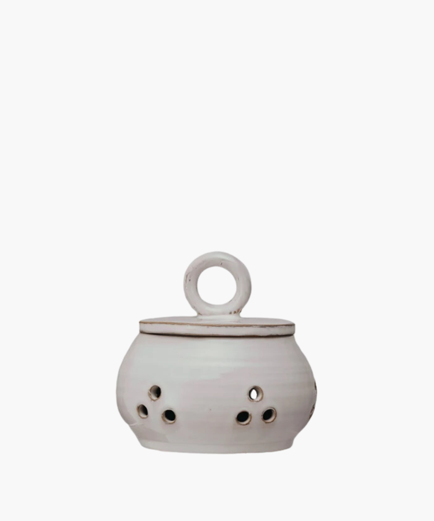 Ceramic garlic or onion keeper with a lid and circular handle, featuring small circular cutouts on the body. The pot has a rustic, handcrafted appearance. | S.W. Home