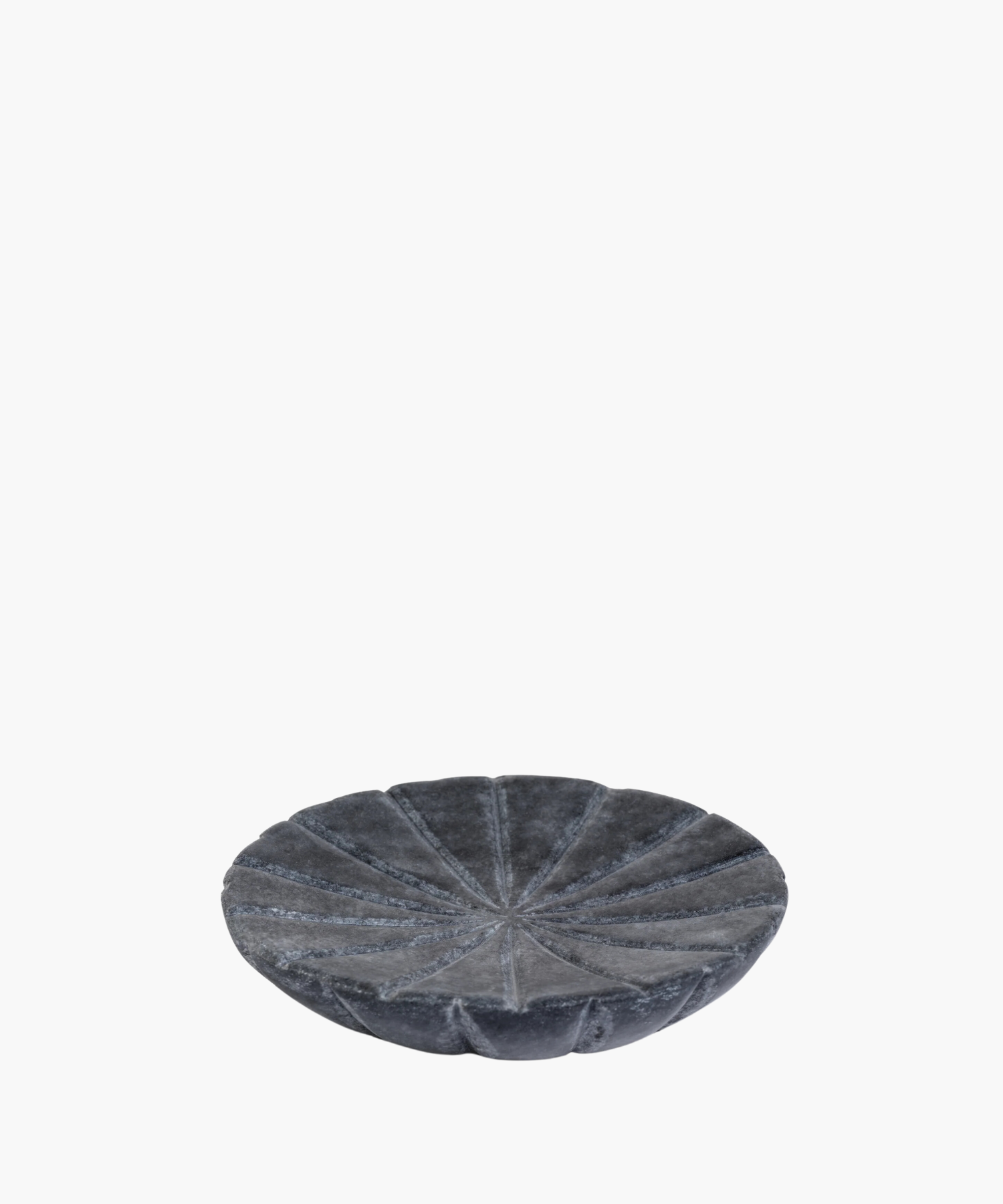 A round, textured gray stone bowl with a segmented, flower-like design on its surface. The bowl has a modern, minimalist aesthetic, conveying elegance. | SW Home