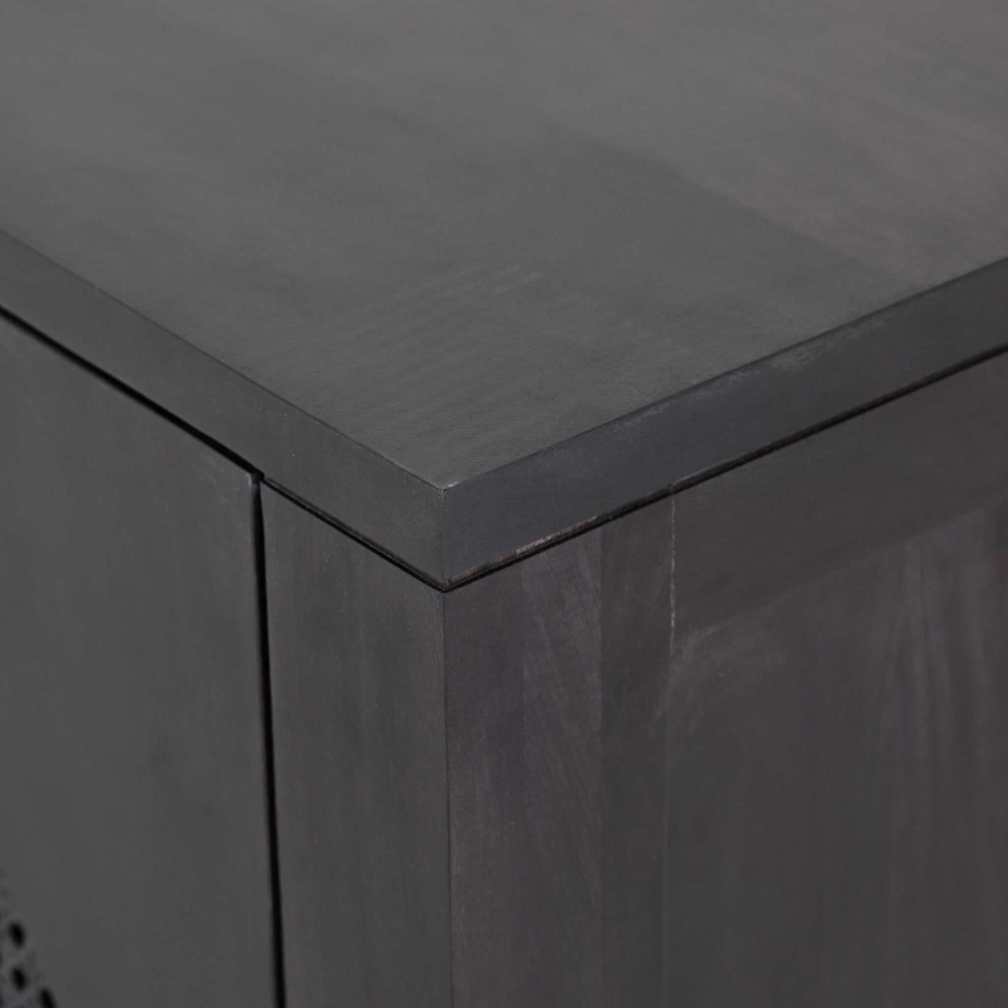 Closeup of the top of the the black Tilde Sideboard.