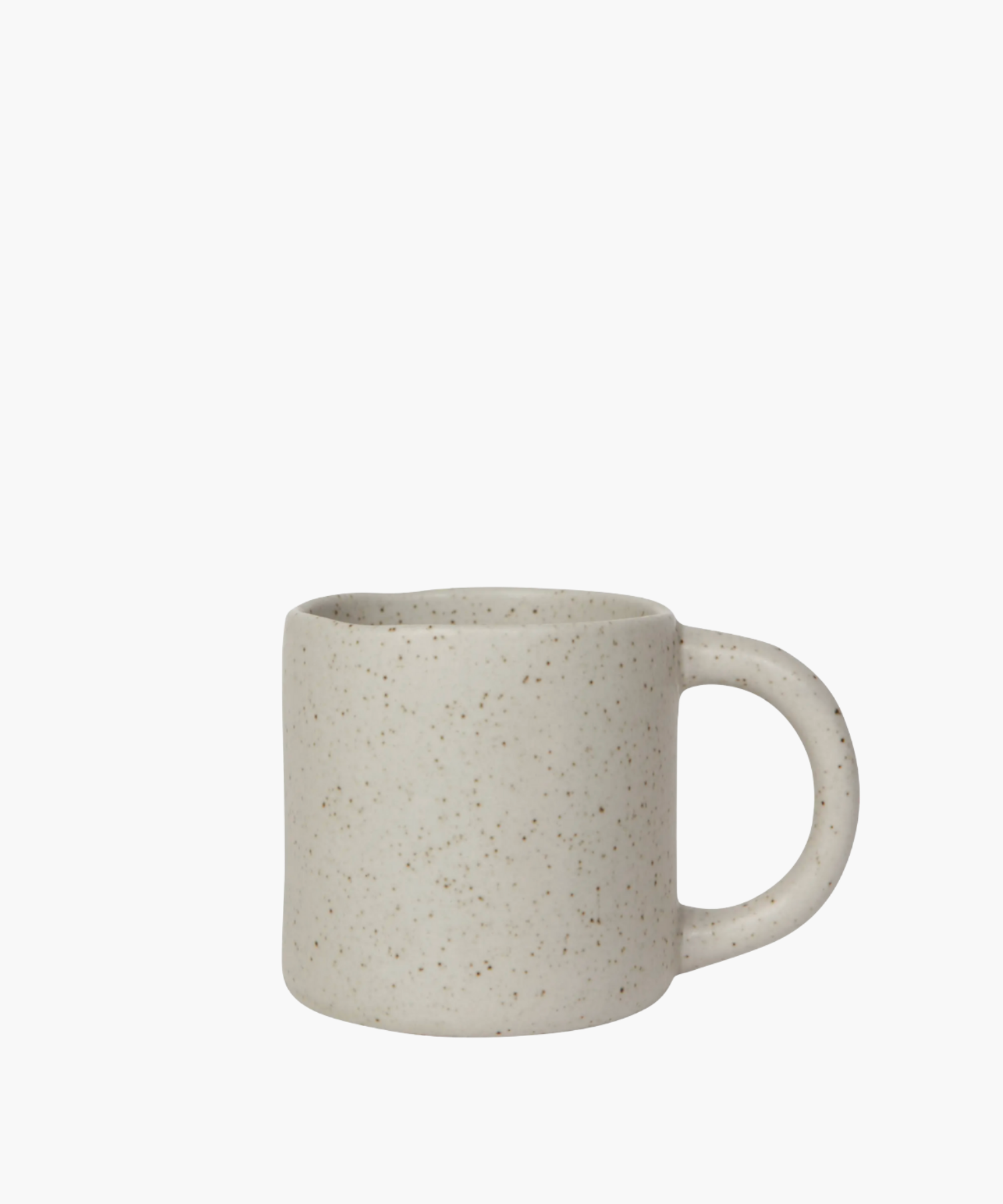 A speckled beige ceramic mug with a smooth surface and a curved handle. The mug has a rustic, minimalist design, evoking a cozy and comforting feel. | S.W. Home