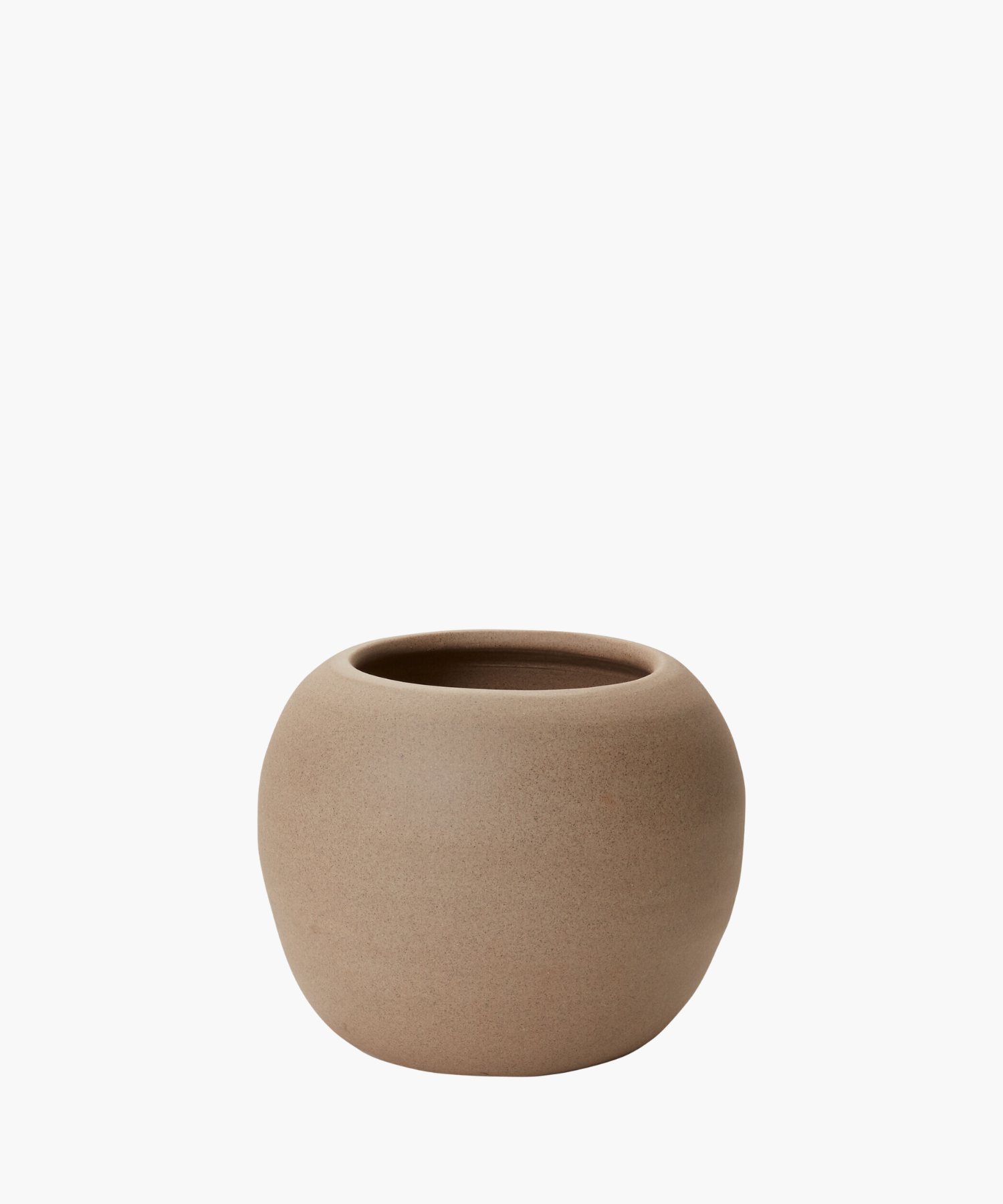 A round, light brown ceramic pot with a smooth, matte texture is centered on a plain white background. The pot exudes simplicity and elegance. | S.W. Home