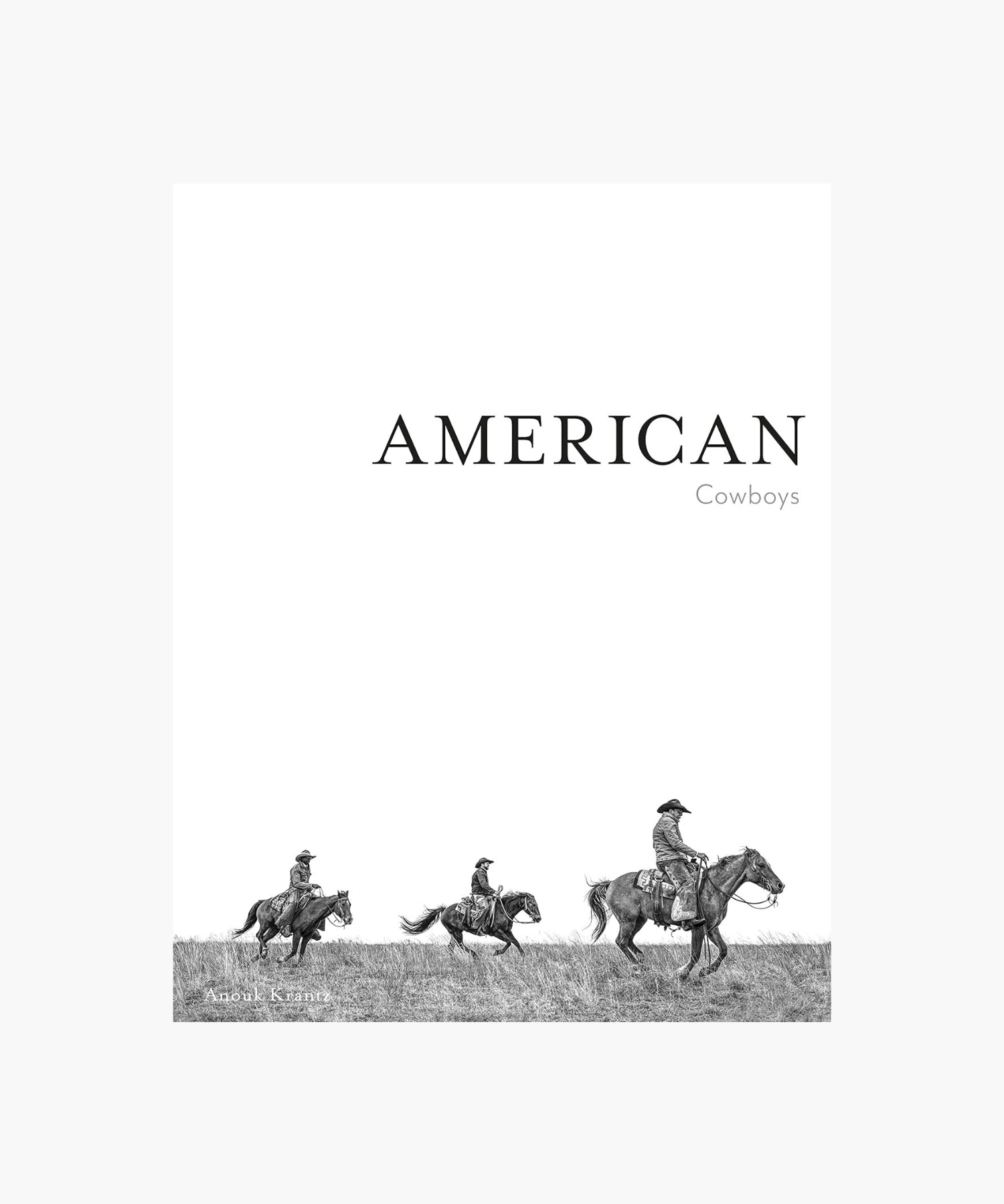 The cover of the book "American Cowboys" by Anouk Krantz features three cowboys on horseback, riding across a grassy field, conveying a sense of adventure and the American West. | S.W. Home