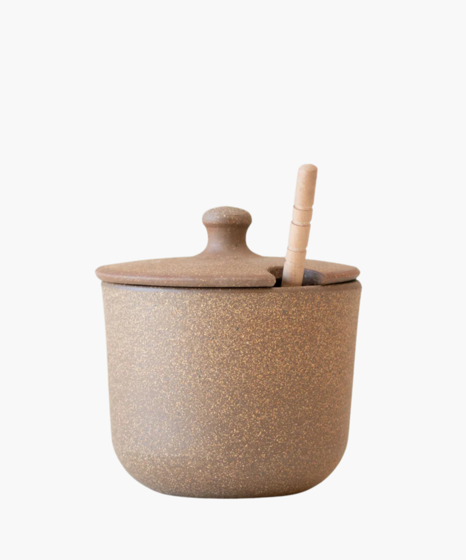 A rustic brown ceramic sugar jar or honey pot with a speckled texture and a lid, featuring a subtle slot for a wooden spoon, conveying a cozy, earthy vibe. | S.W. Home