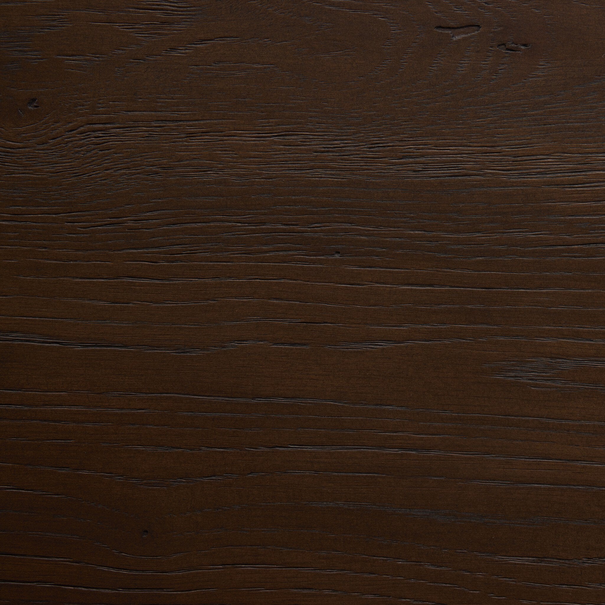 Close up of the dining table showing its color and wood grain. 