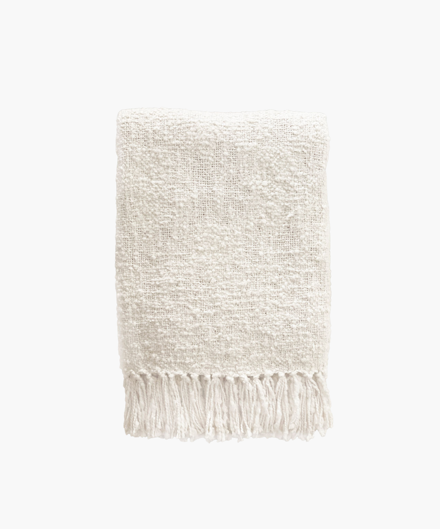 A soft, ivory colored woven throw blanket with a textured pattern and fringed edges, conveying a cozy and inviting feel. | S.W. Home
