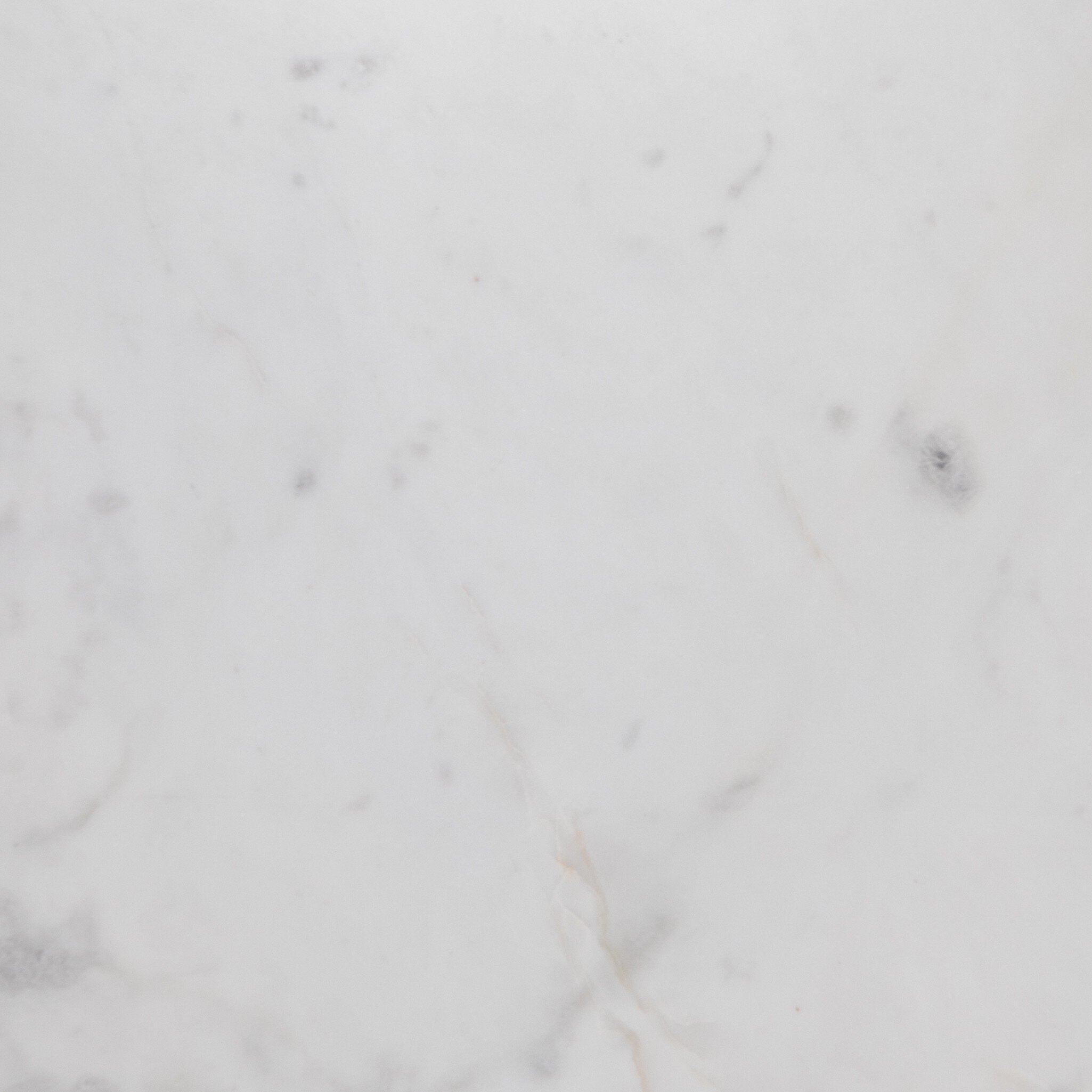 Close up picture of the marble top showing its color and subtle veining. 