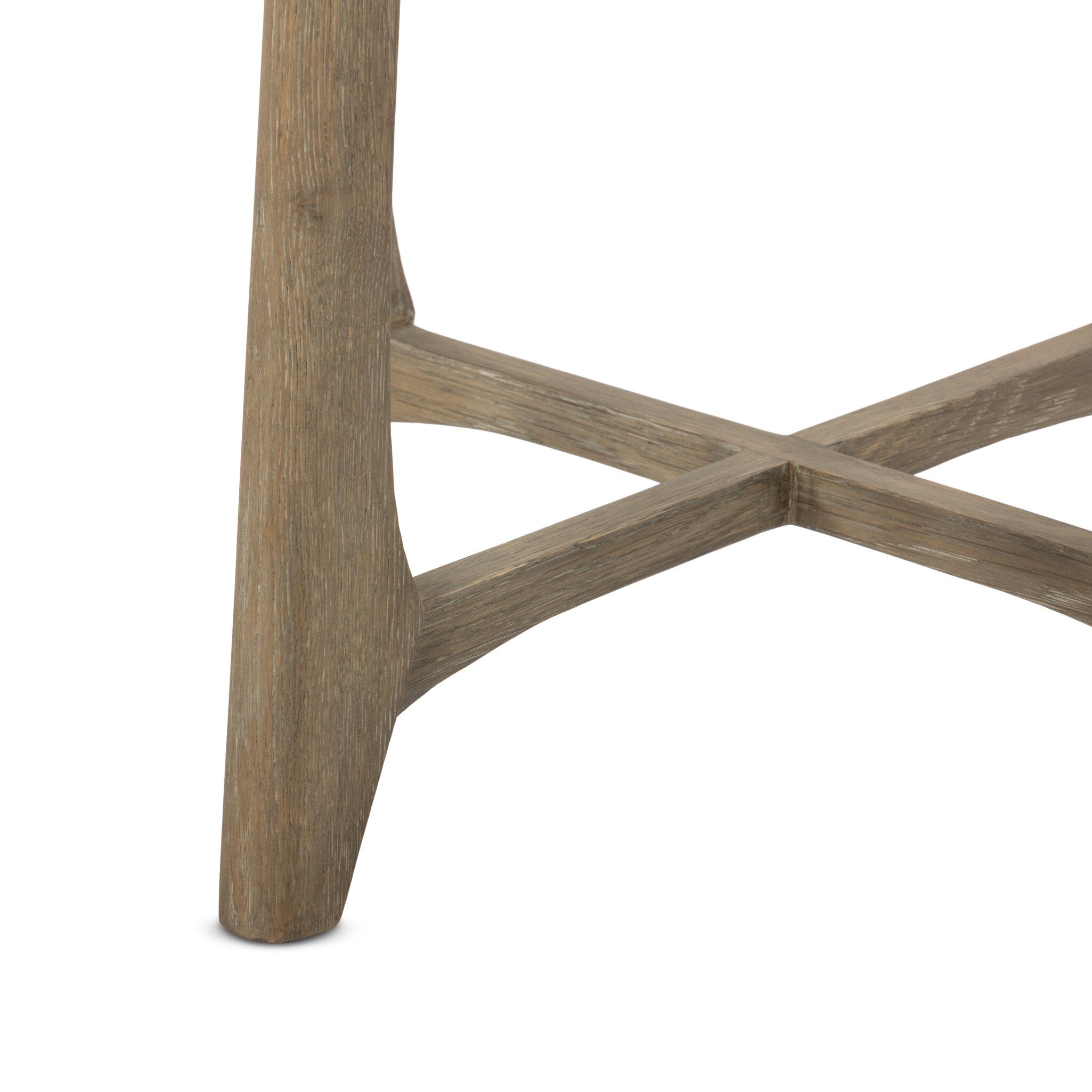 Close-up of a wooden artisan table leg detail with a white background.