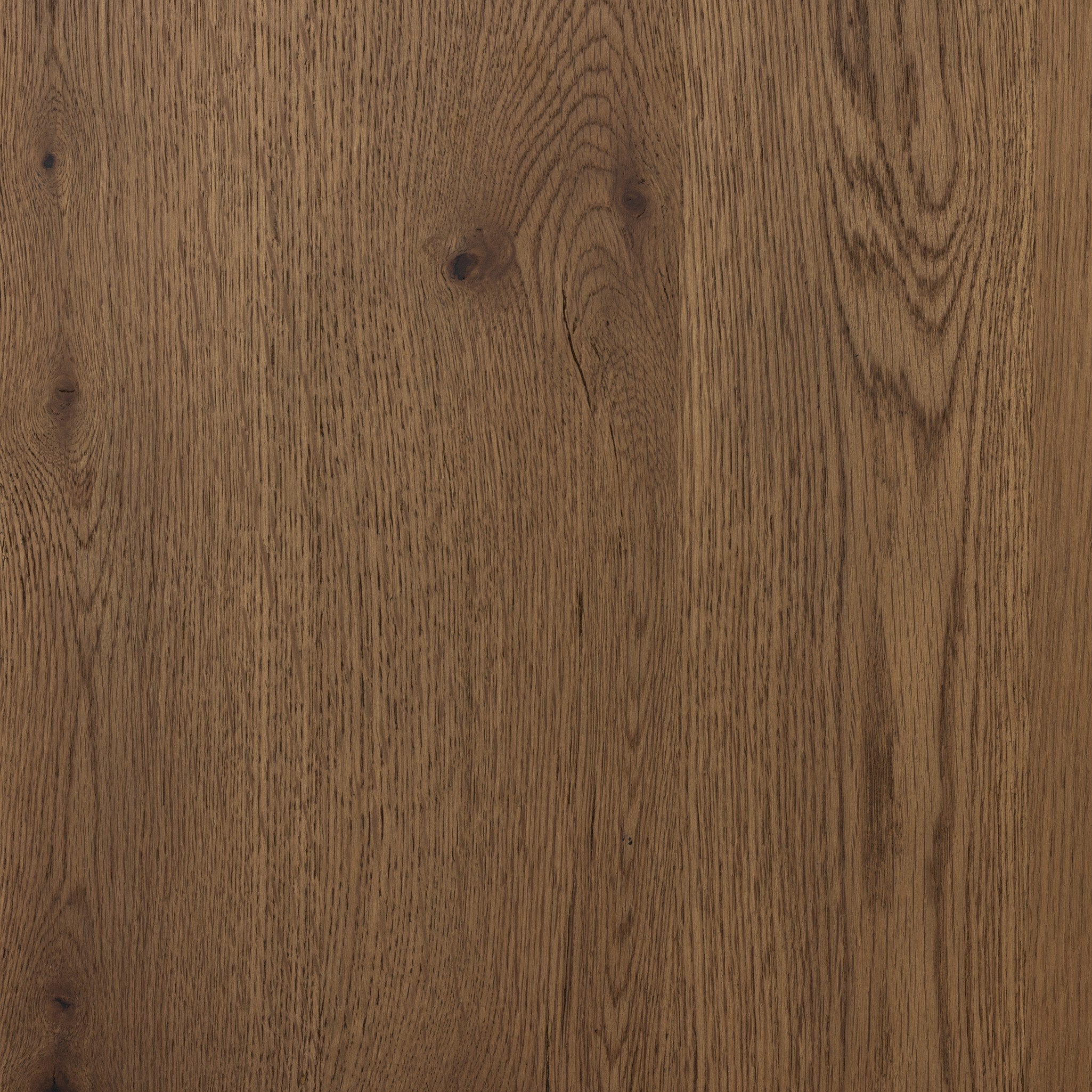 Close up of the dining table showing its color and wood grain. 