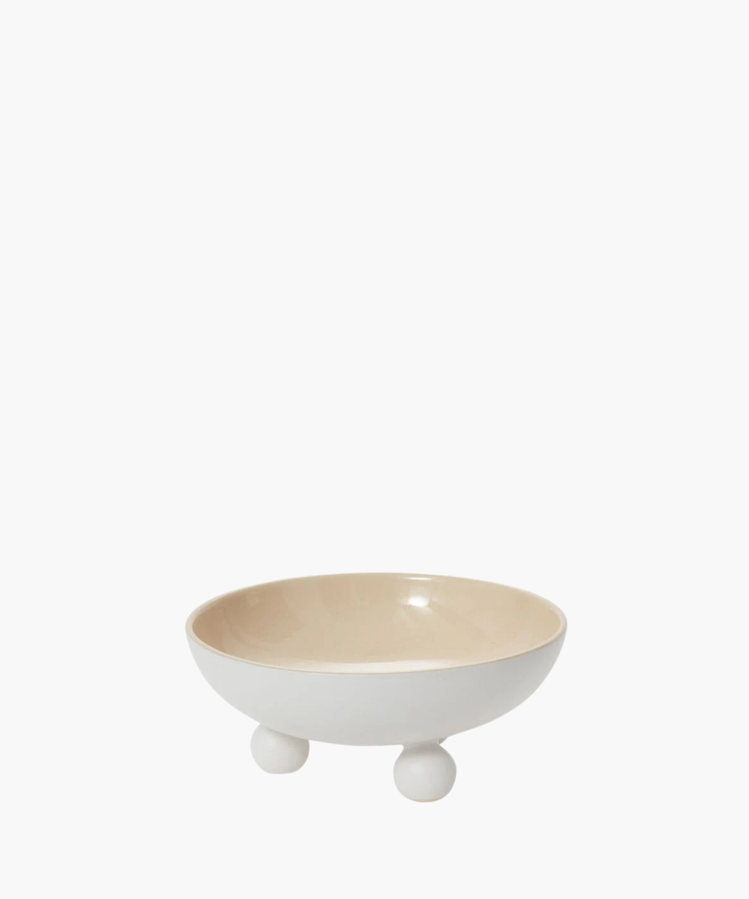 A minimalist white ceramic bowl with a smooth, glossy finish sits on three round feet. The interior is a light beige, conveying simplicity and elegance. | S.W. Home