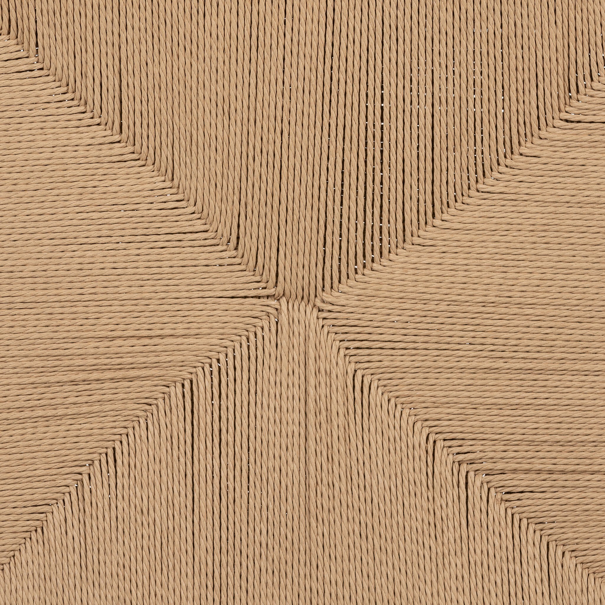 Close up of the woven seat from the outdoor dining chair showing its color, texture, and weave pattern. 