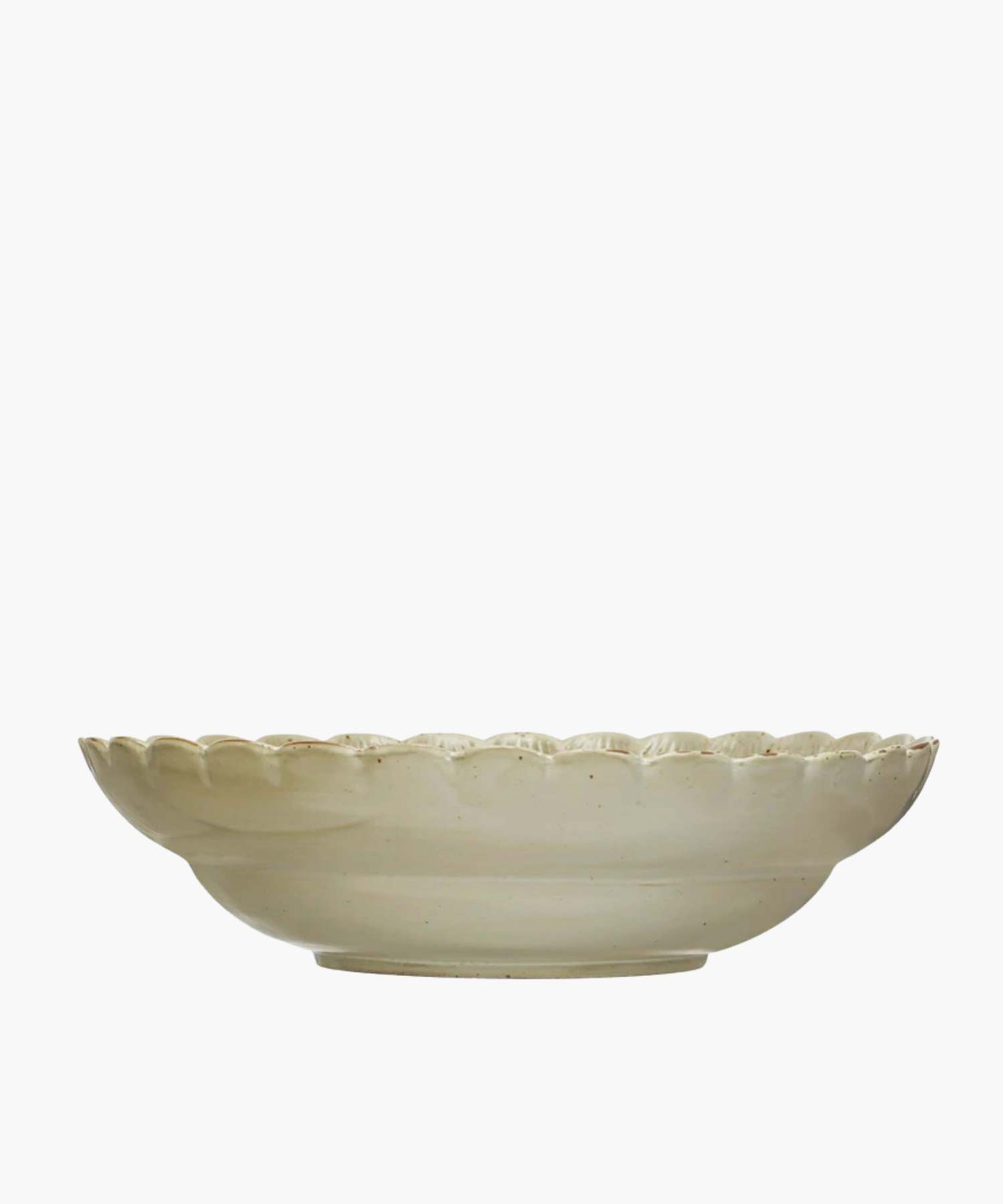 A Scandinavian-inspired stoneware bowl with a scalloped edge and a naturally variating reactive green glaze. The minimalist design gives an elegant and timeless appearance. | S.W. Home